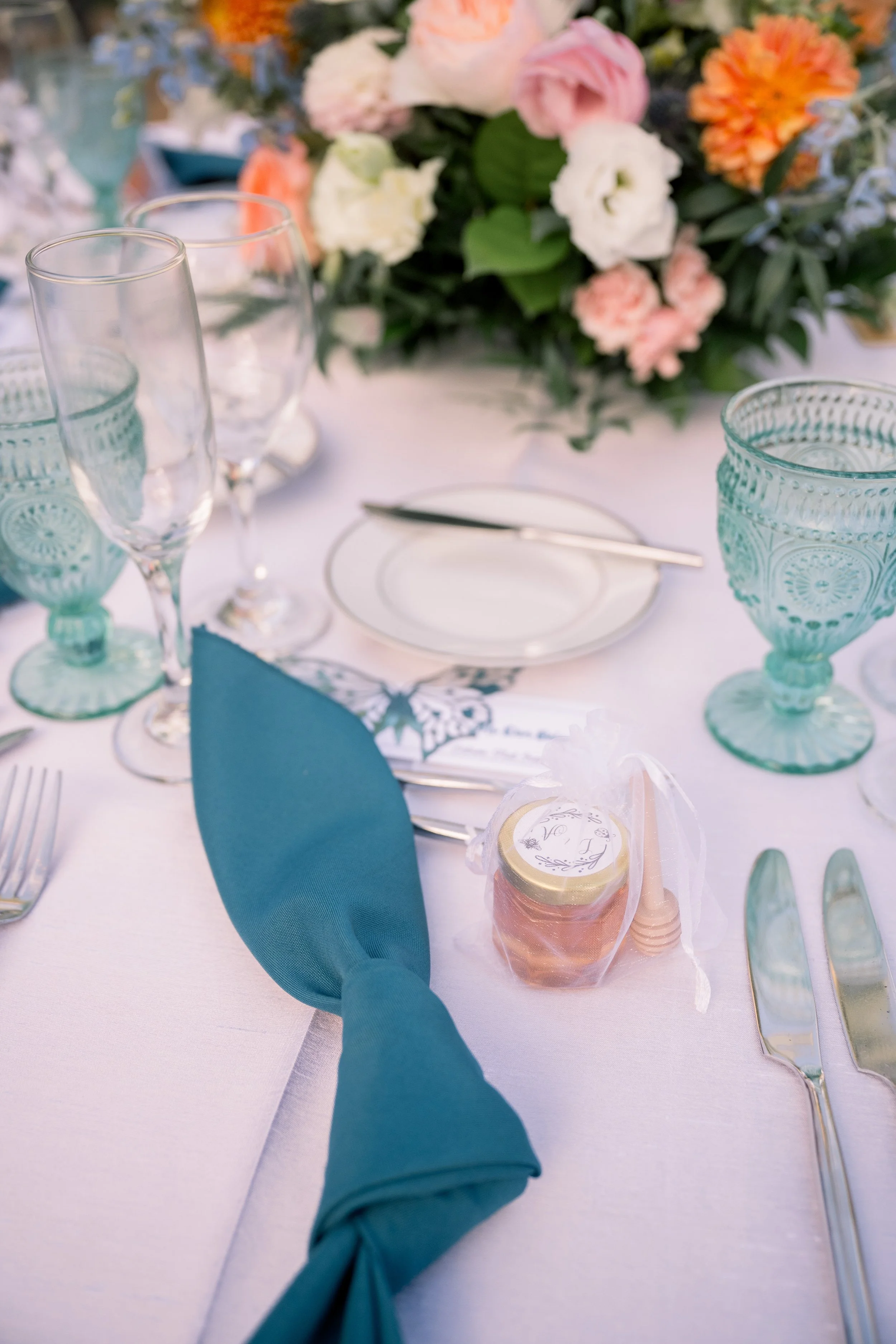 teal napkin on colorful garden wedding table design