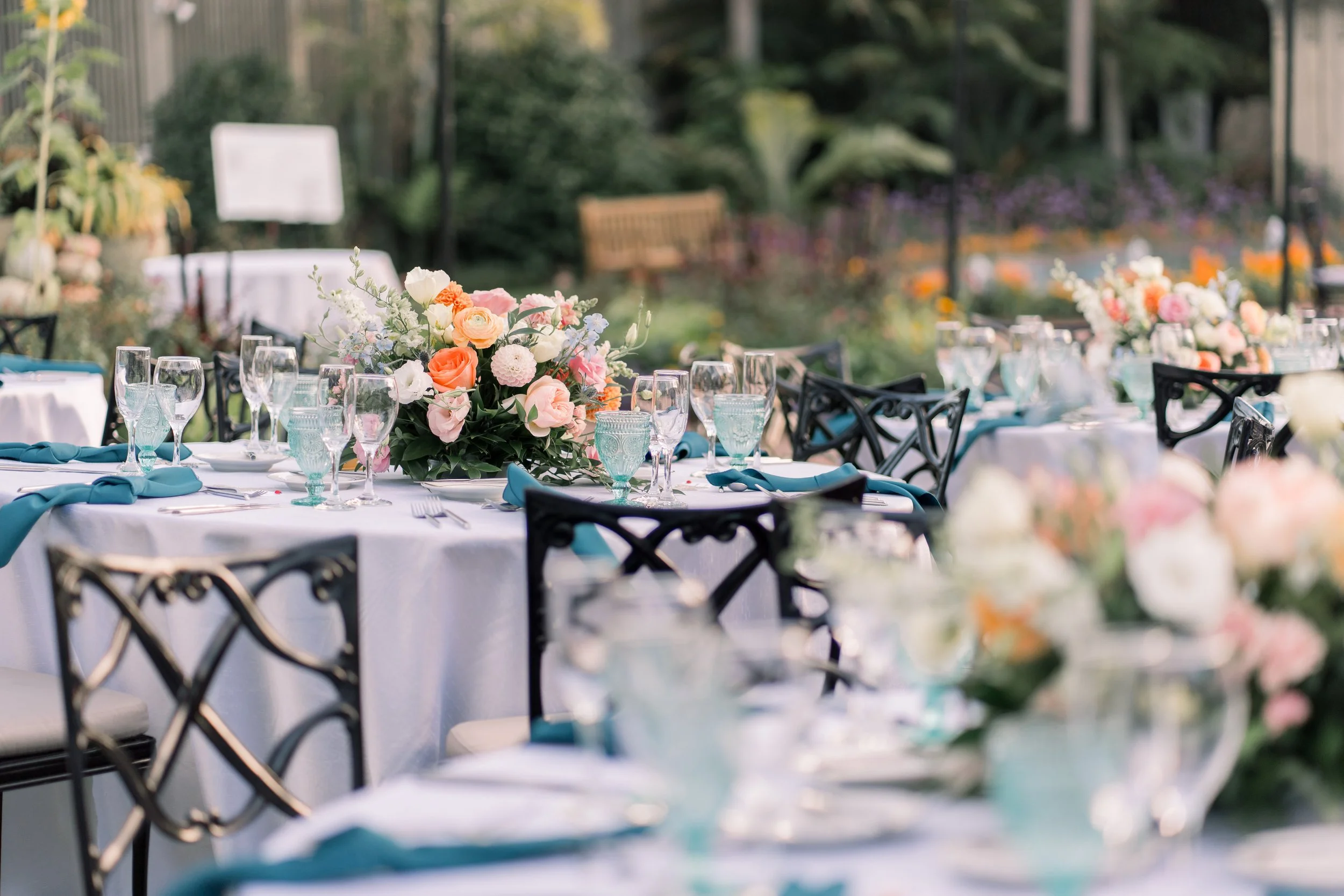Colorful Garden Wedding Tablescape with Teal and Peach Floral Design