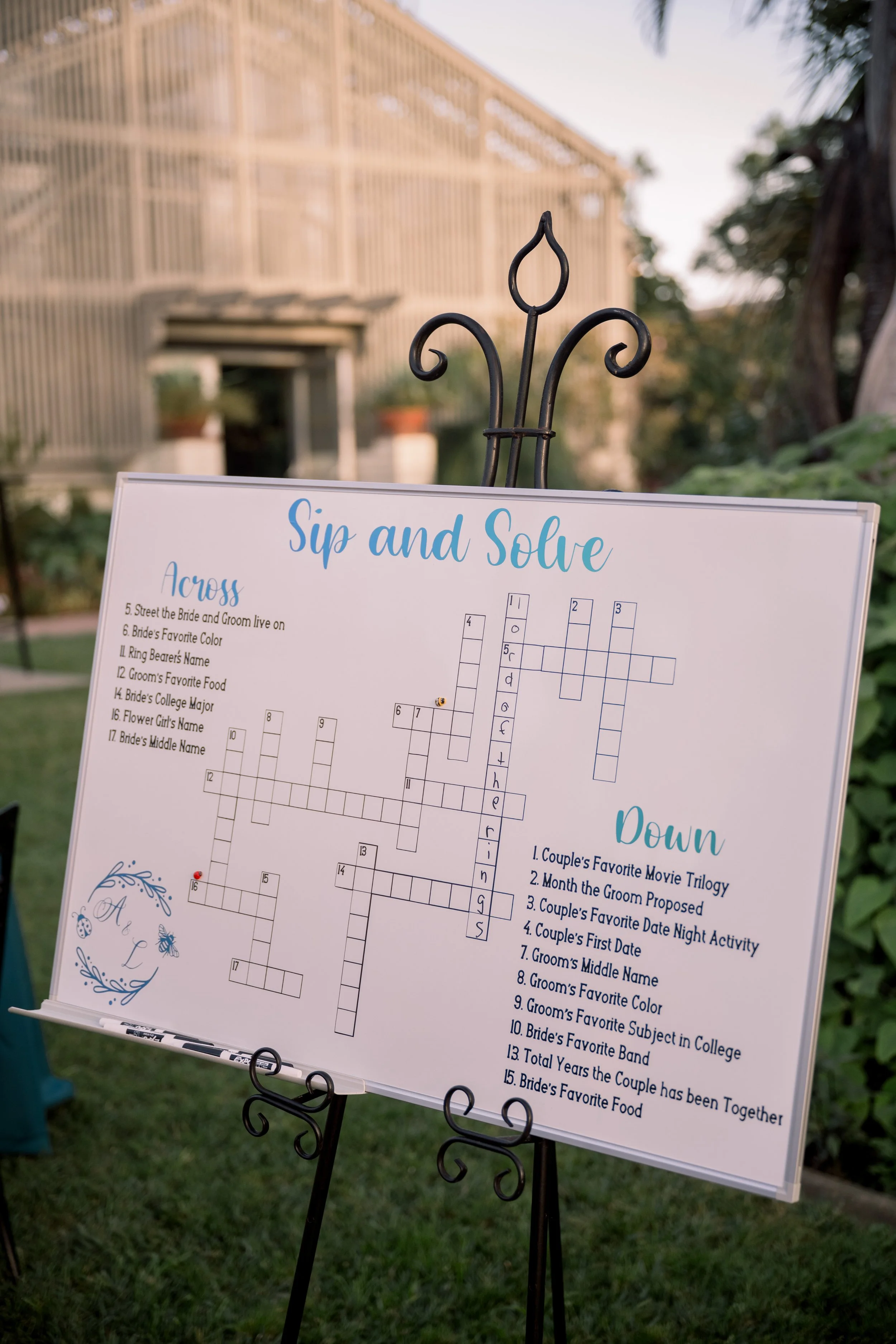 Custom wedding crossword puzzle sign displayed for guests during cocktail hour and reception