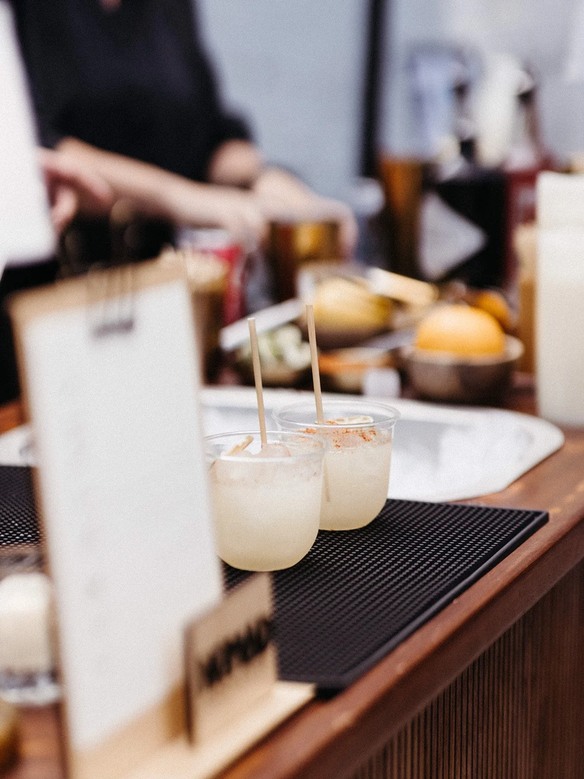 Signature cocktails displayed at the wedding bar, adding a personalized food and beverage experience for guests during the reception.
