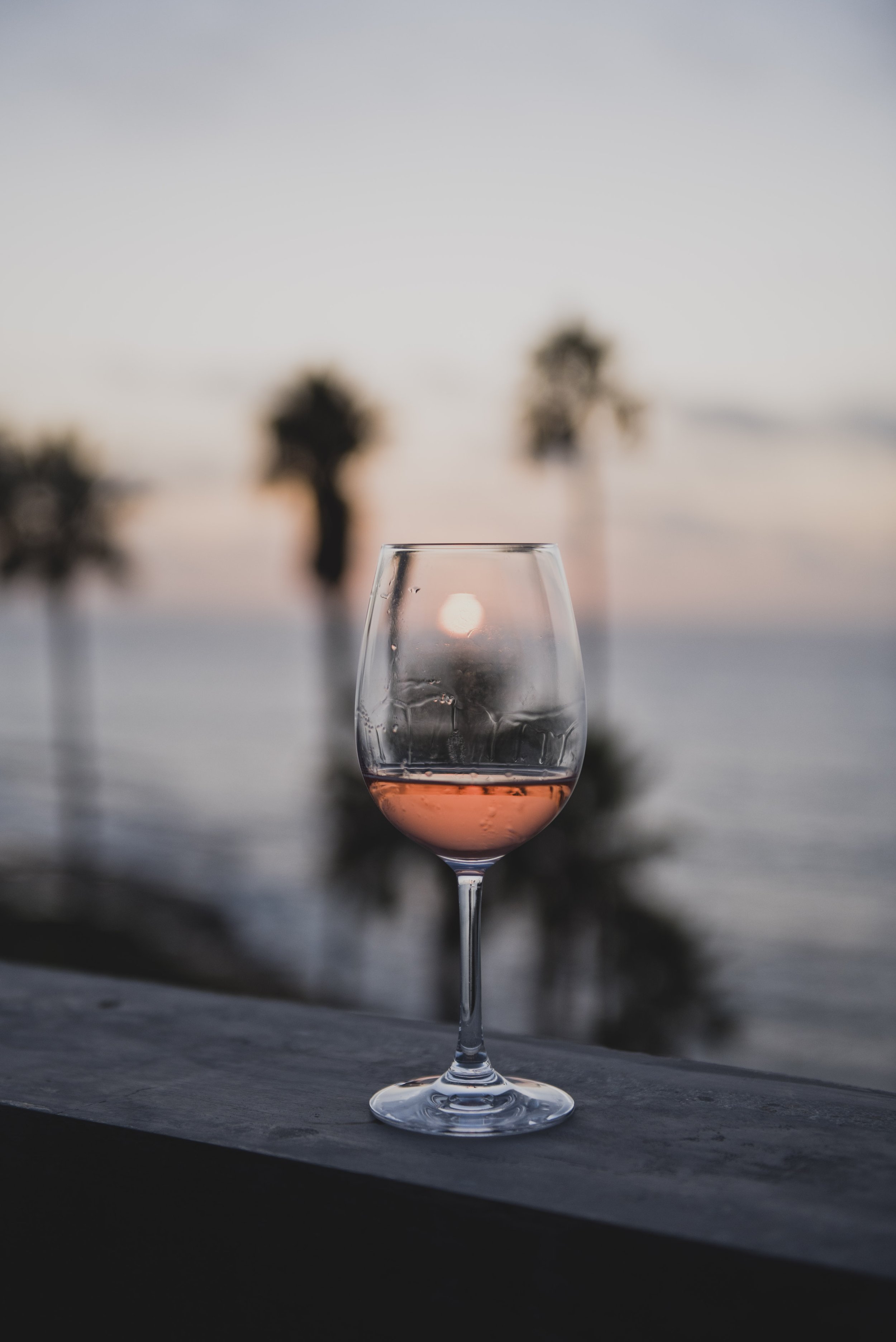 Sunset over the ocean creating a peaceful backdrop for a luxury destination wedding weekend.