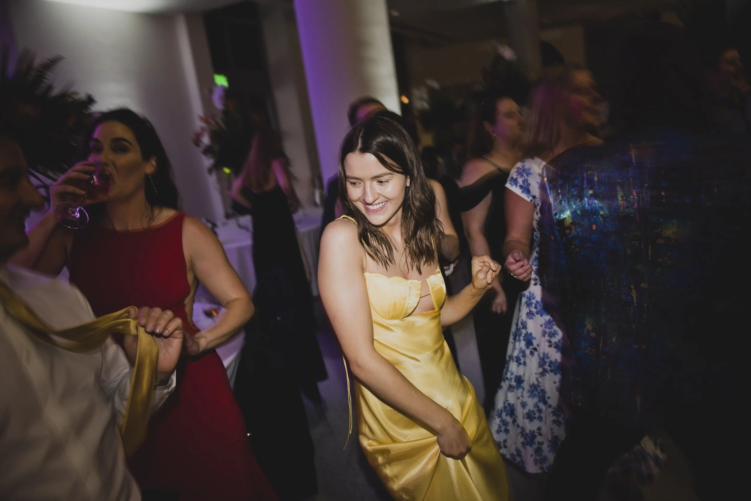 Wedding guest dancing during a lively destination wedding reception, highlighting a fun and memorable guest experience.