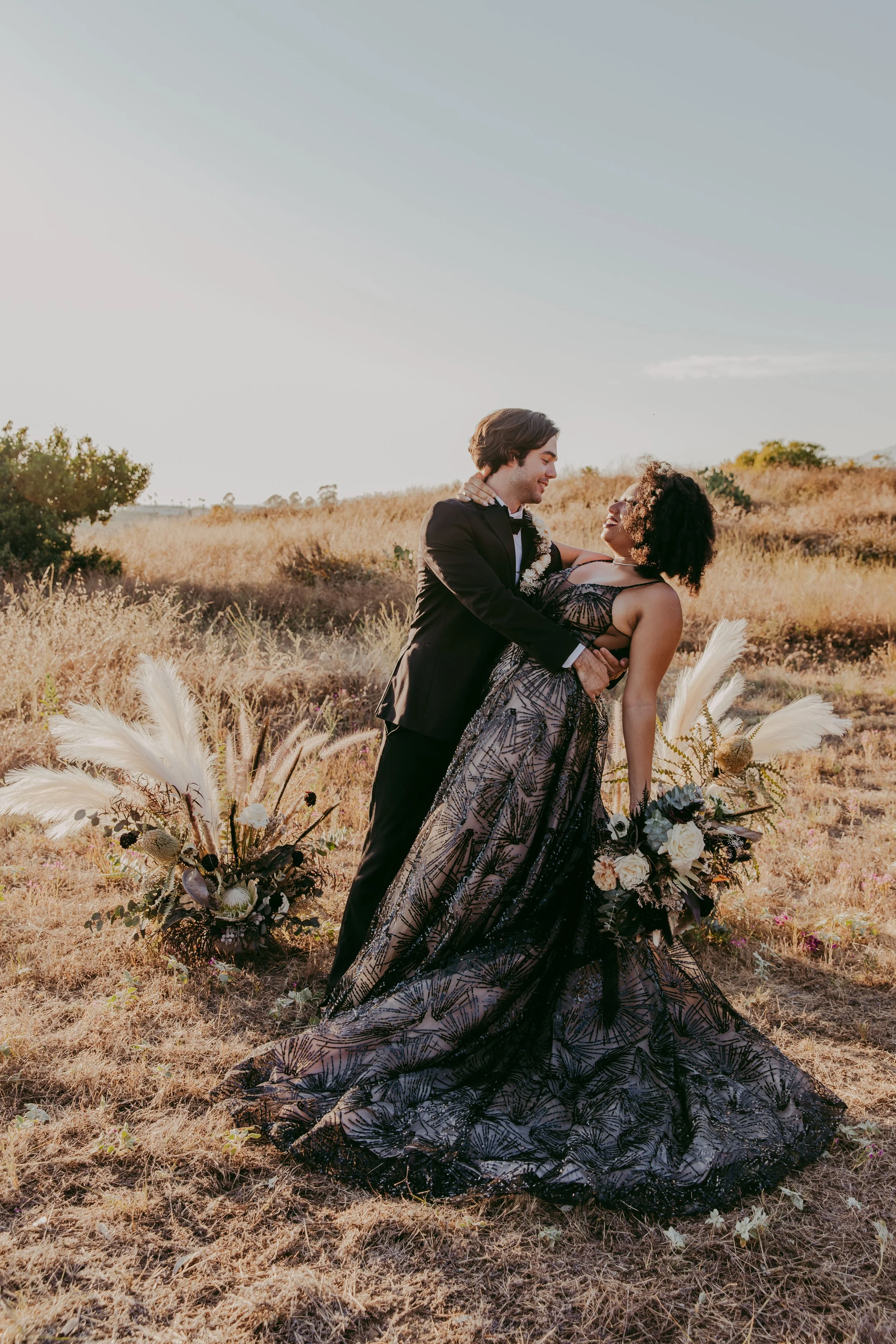 Dramatic couple portrait for a Scar-inspired villain wedding
