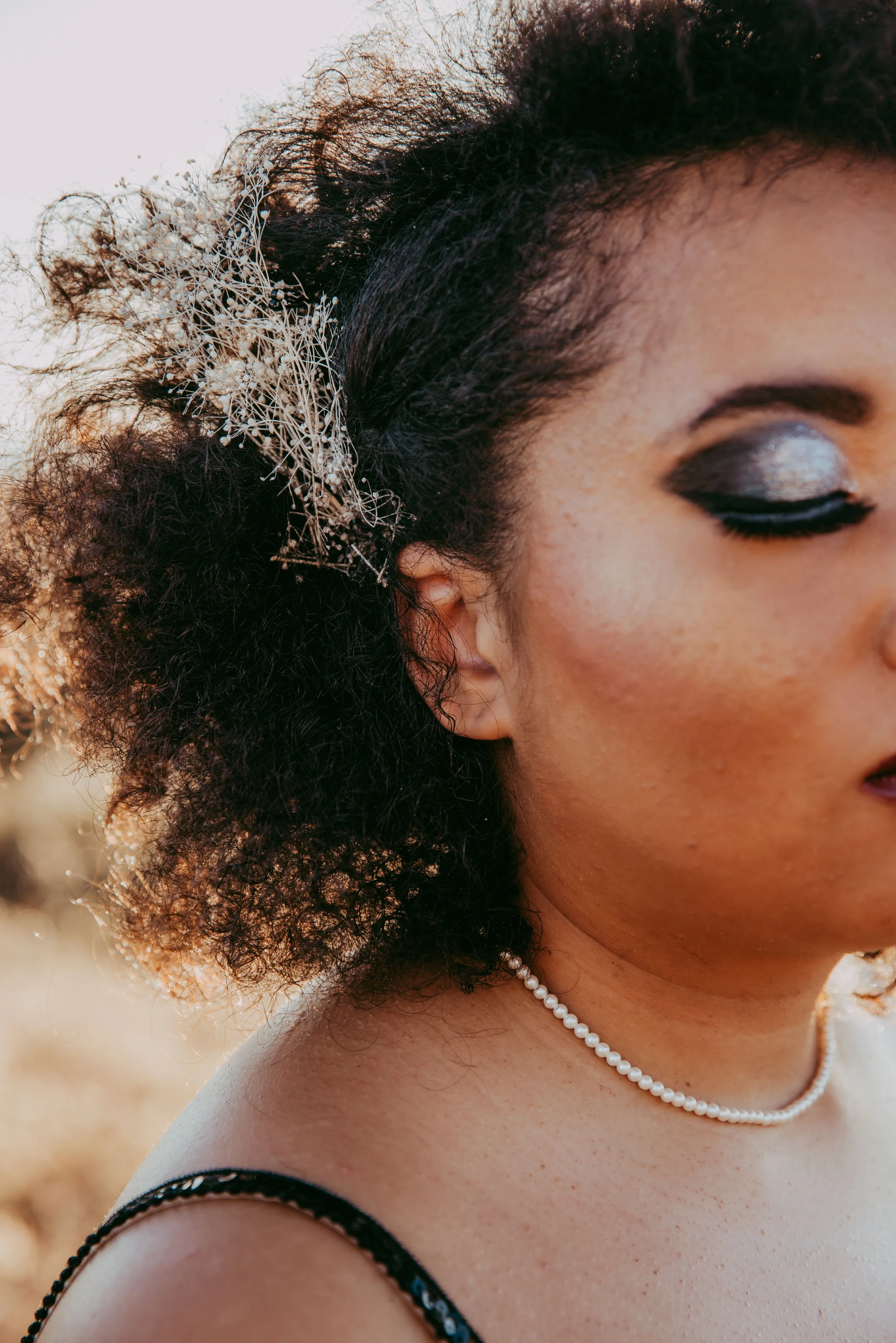 Detail of a bride's floral hair accessory at a Disney villain wedding
