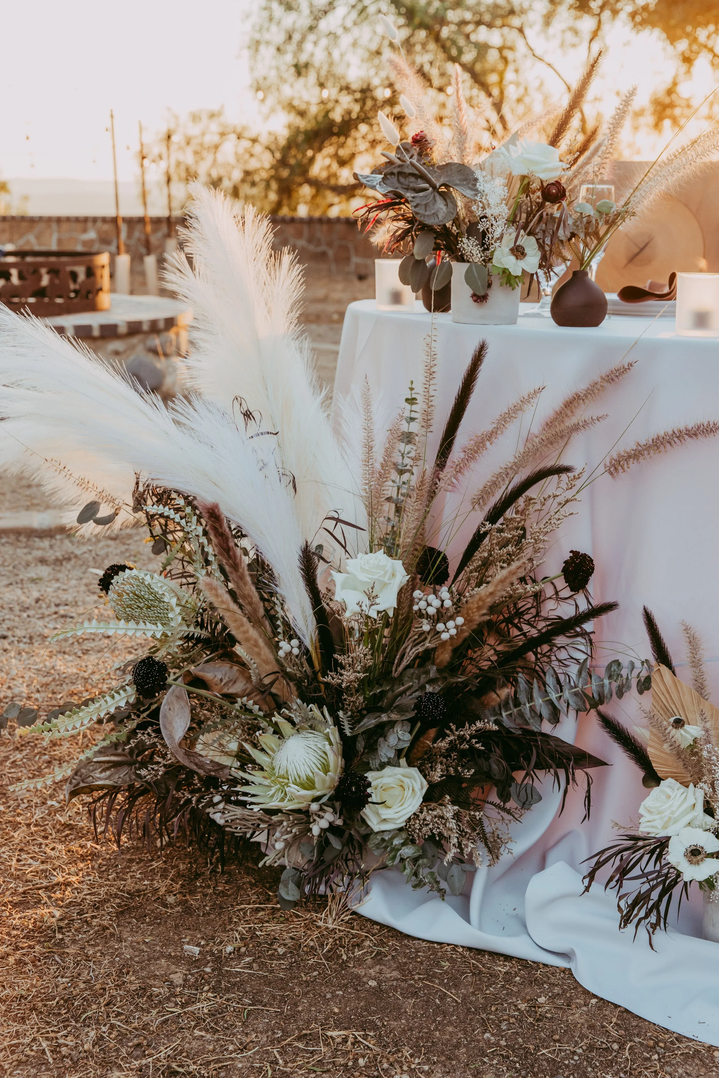 Reception florals in dry, earthy tones for a Lion King Scar wedding theme
