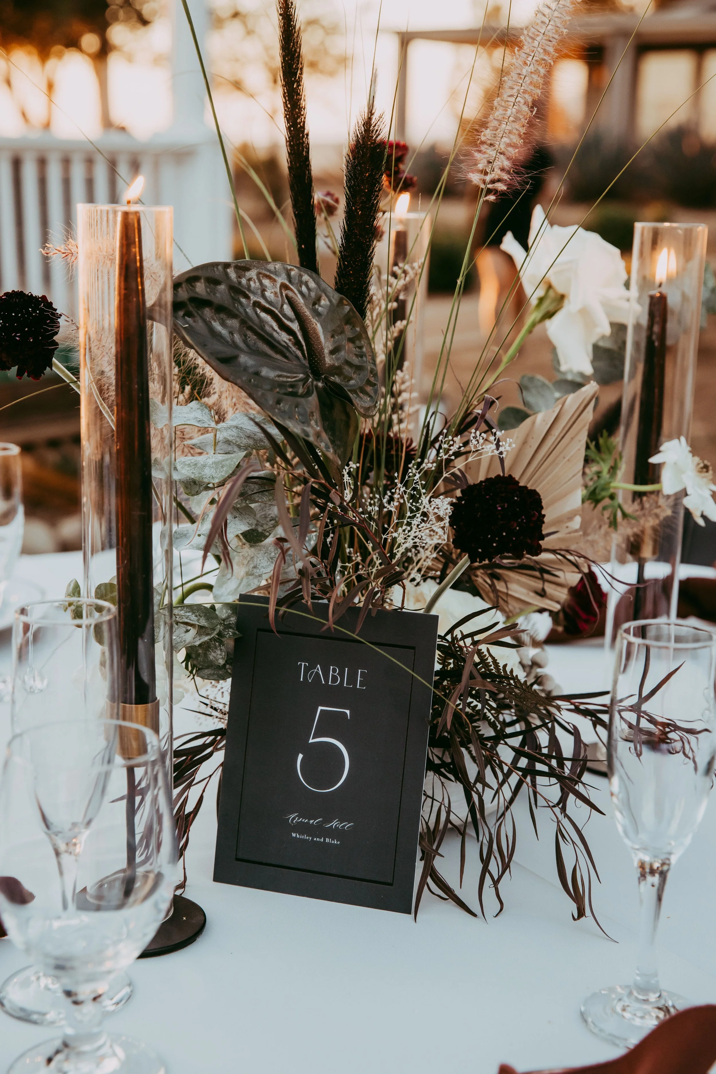 Dried floral centerpiece in deep, earthy tones for a Scar-inspired villain wedding