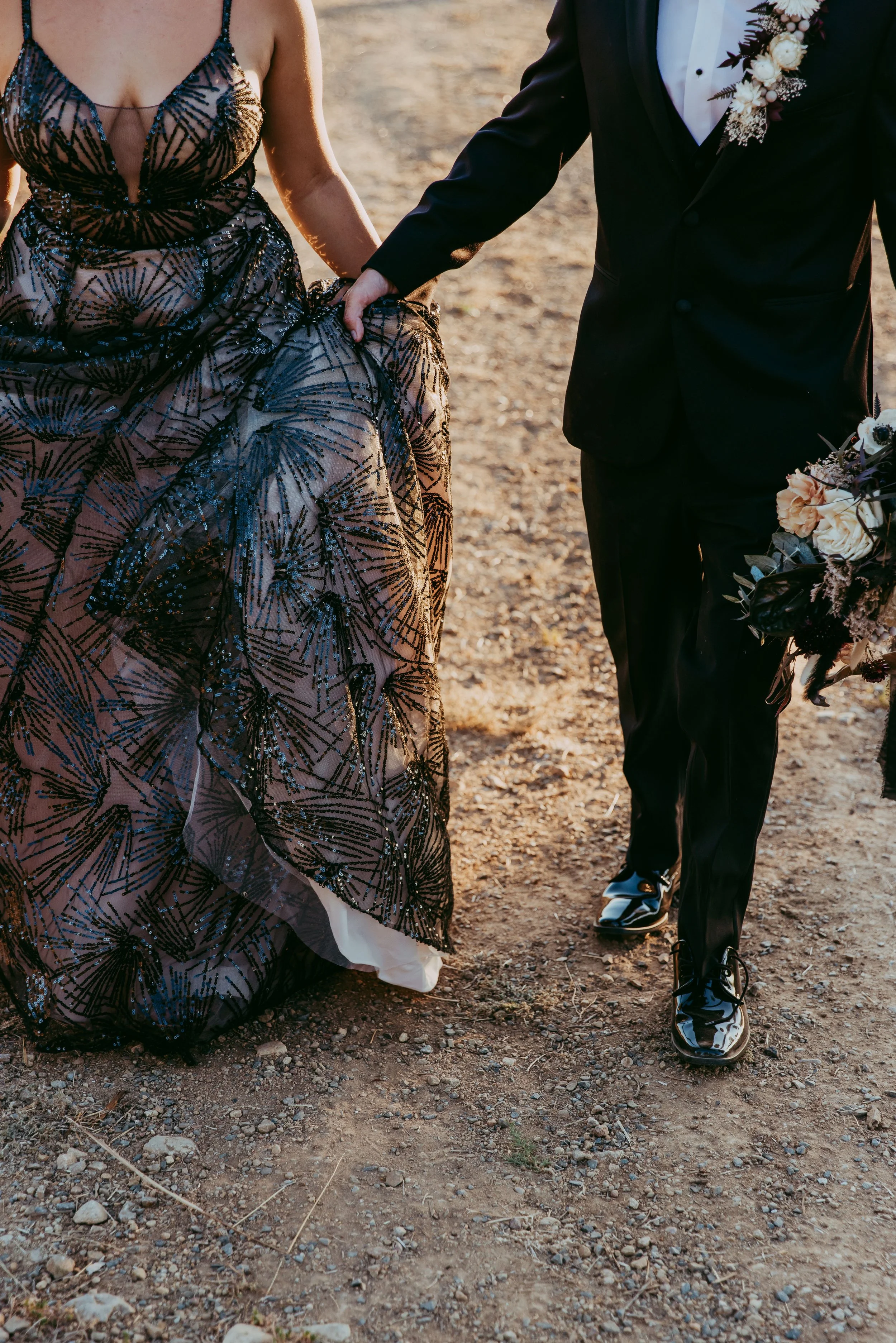 Close-up of dark dried bridal gown details at a Disney villain wedding
