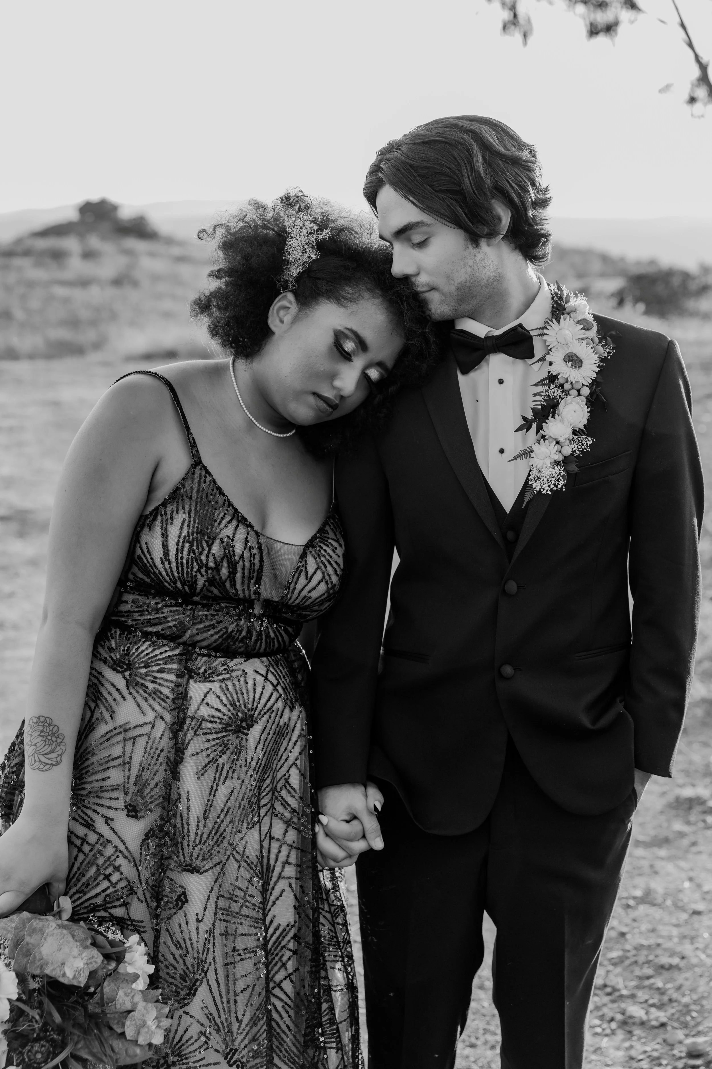 Groom's suit jacket with florals sewn onto the lapel for a villain-themed wedding