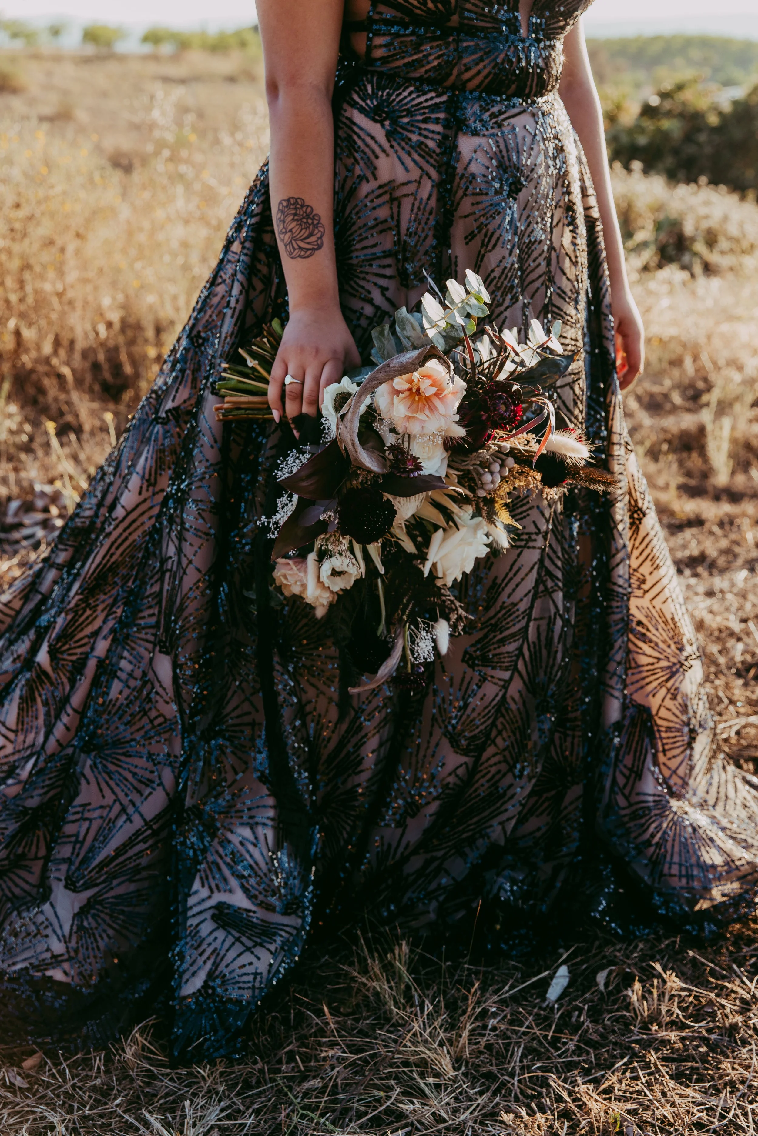 Textural dried florals styled for a dark alternative wedding