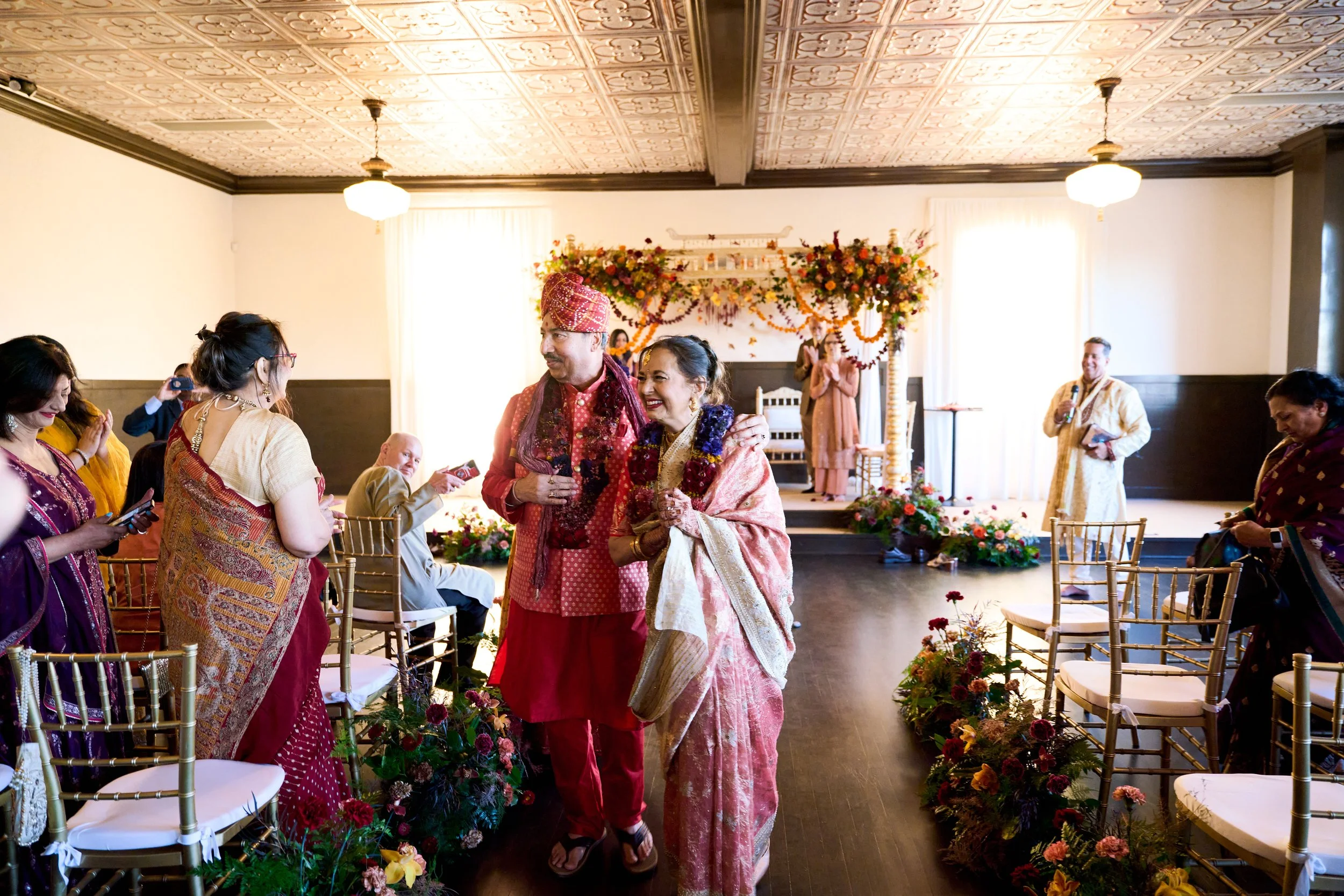 Dark floral design dressing the mandap at an Indian wedding