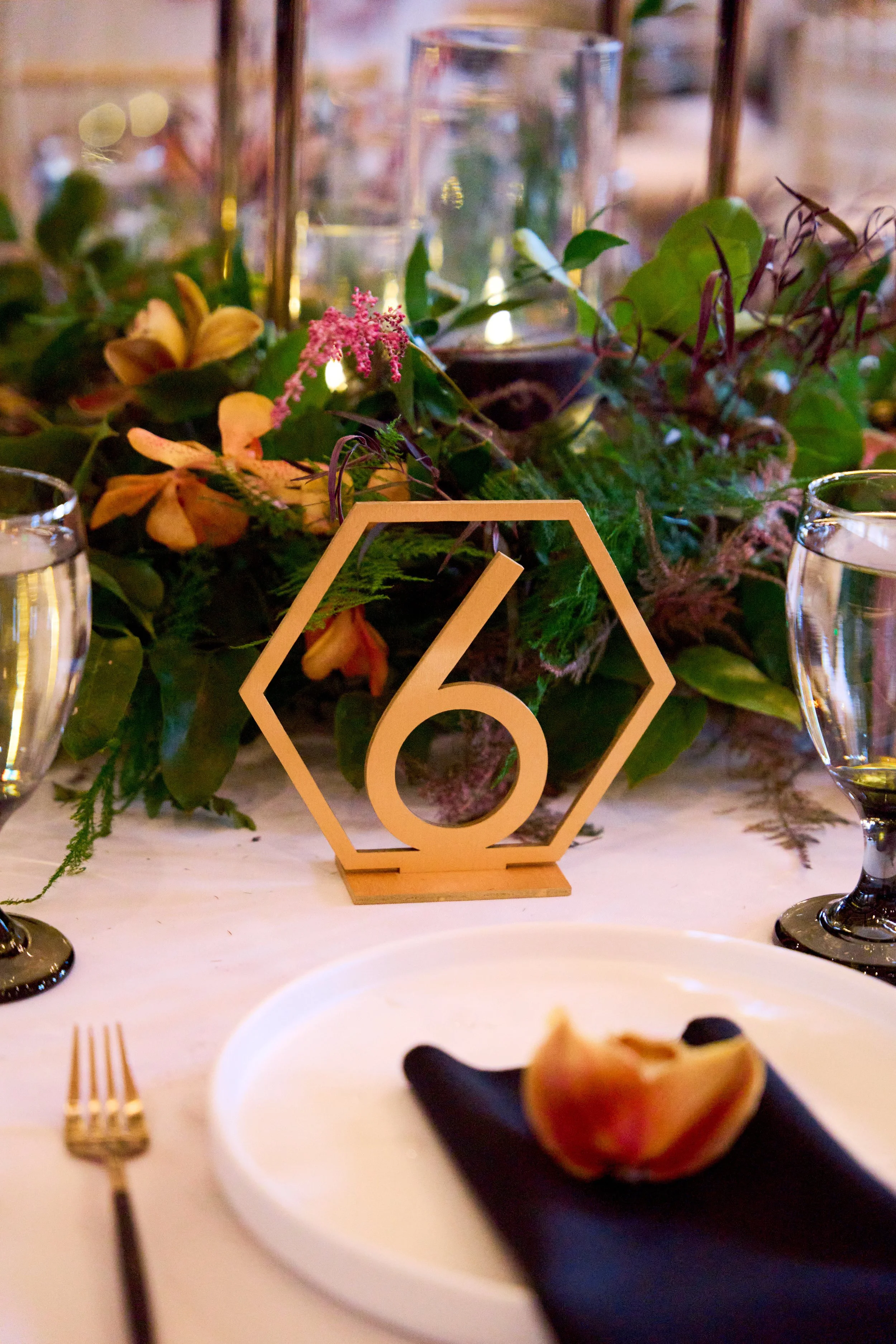 Gold and candlelight details on an Indian wedding tablescape