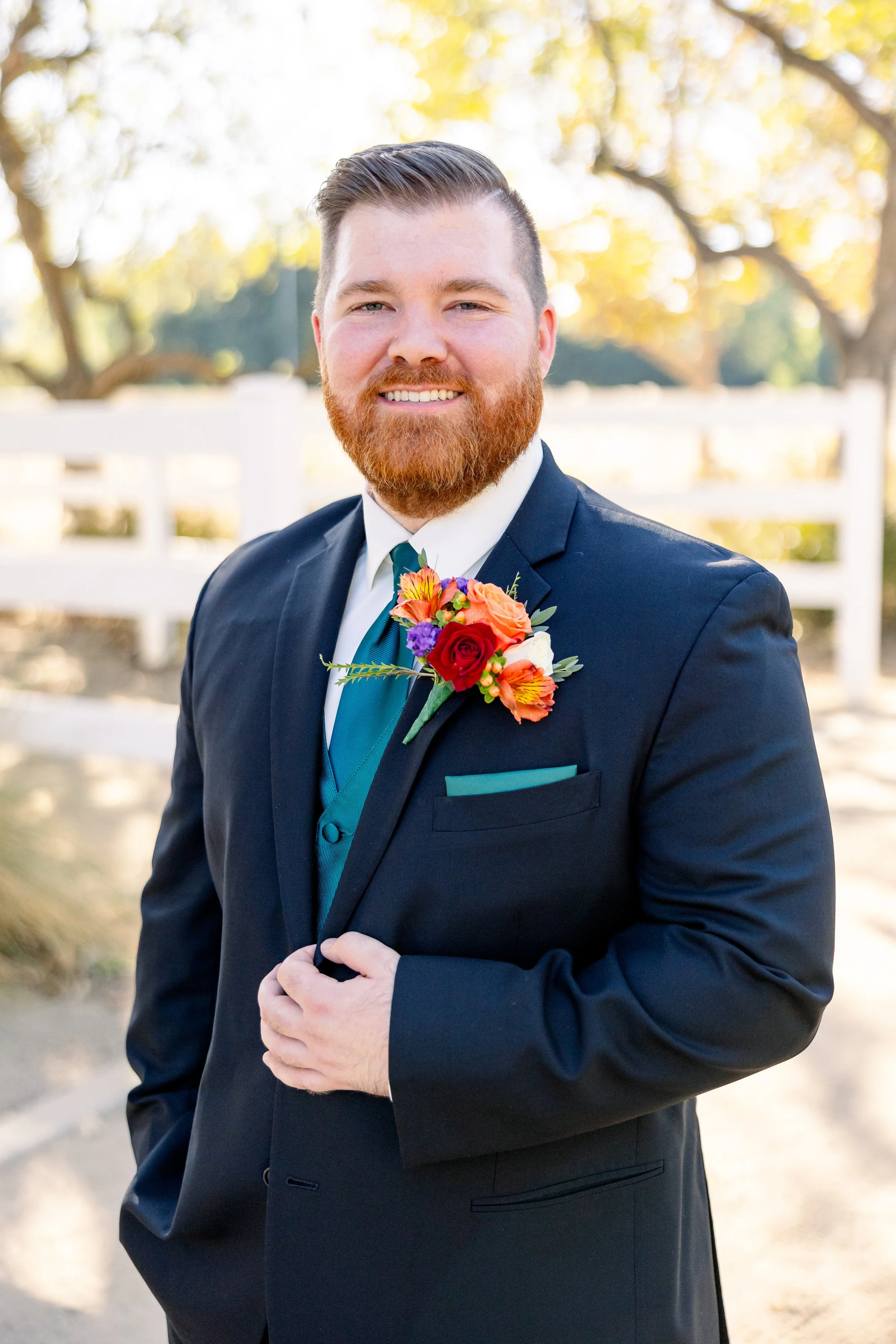 Rust-toned boutonniere for a fall wedding