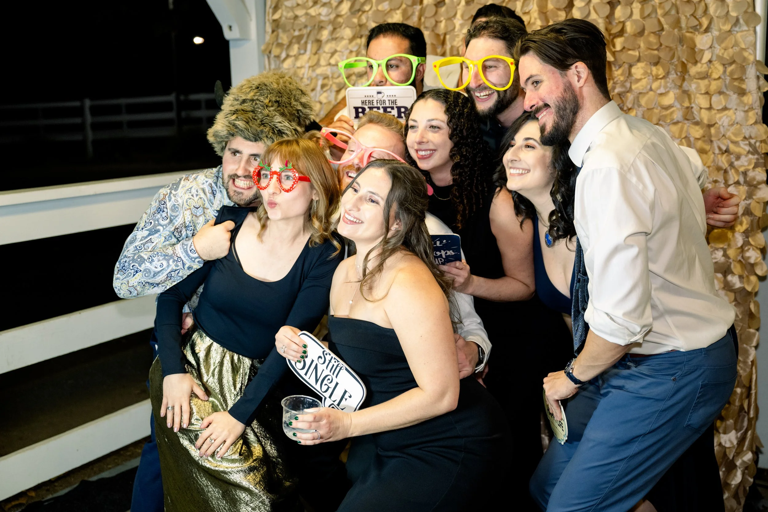 Guests at the photobooth at a fall wedding reception