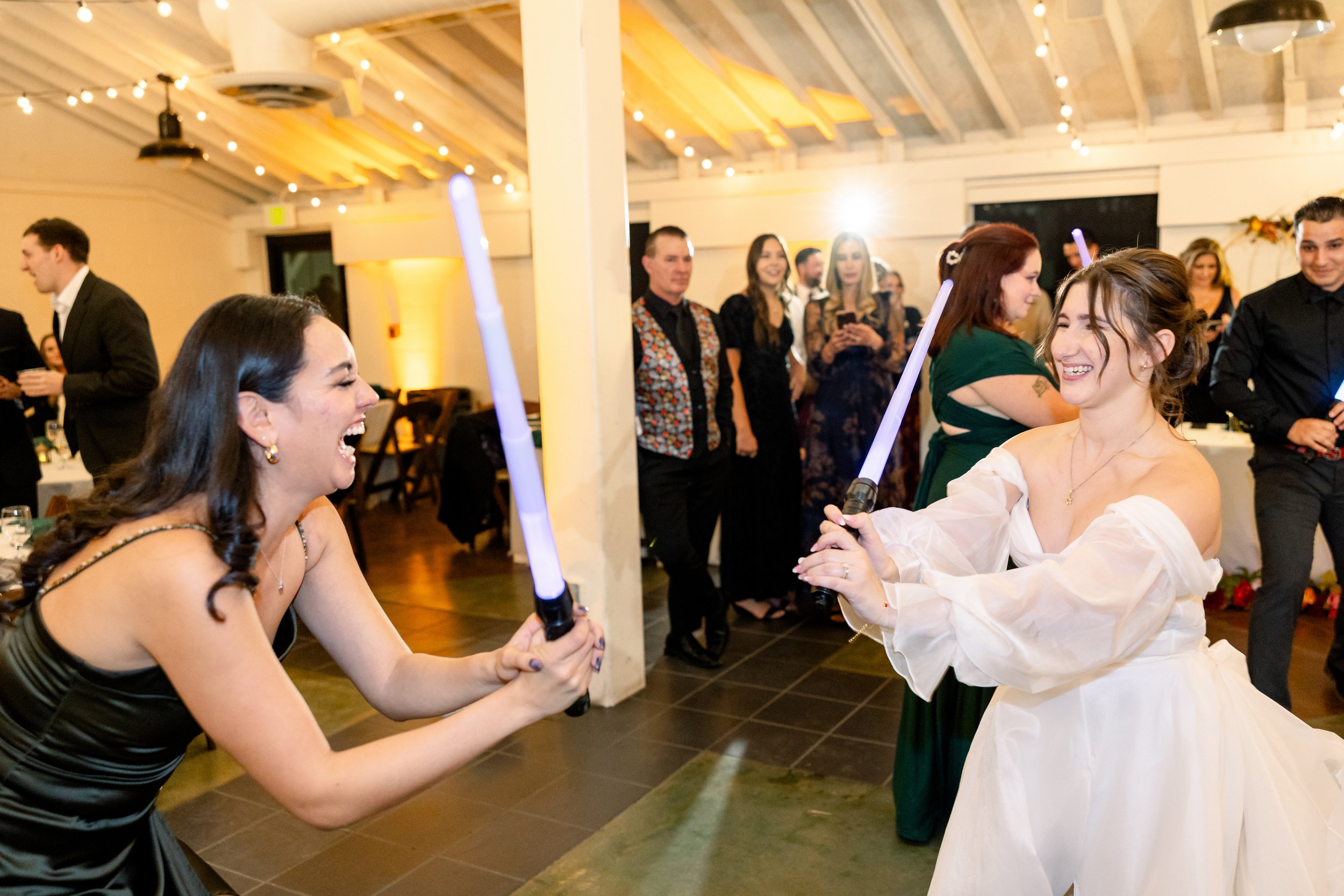 A lightsaber group dance at a non-traditional fall wedding