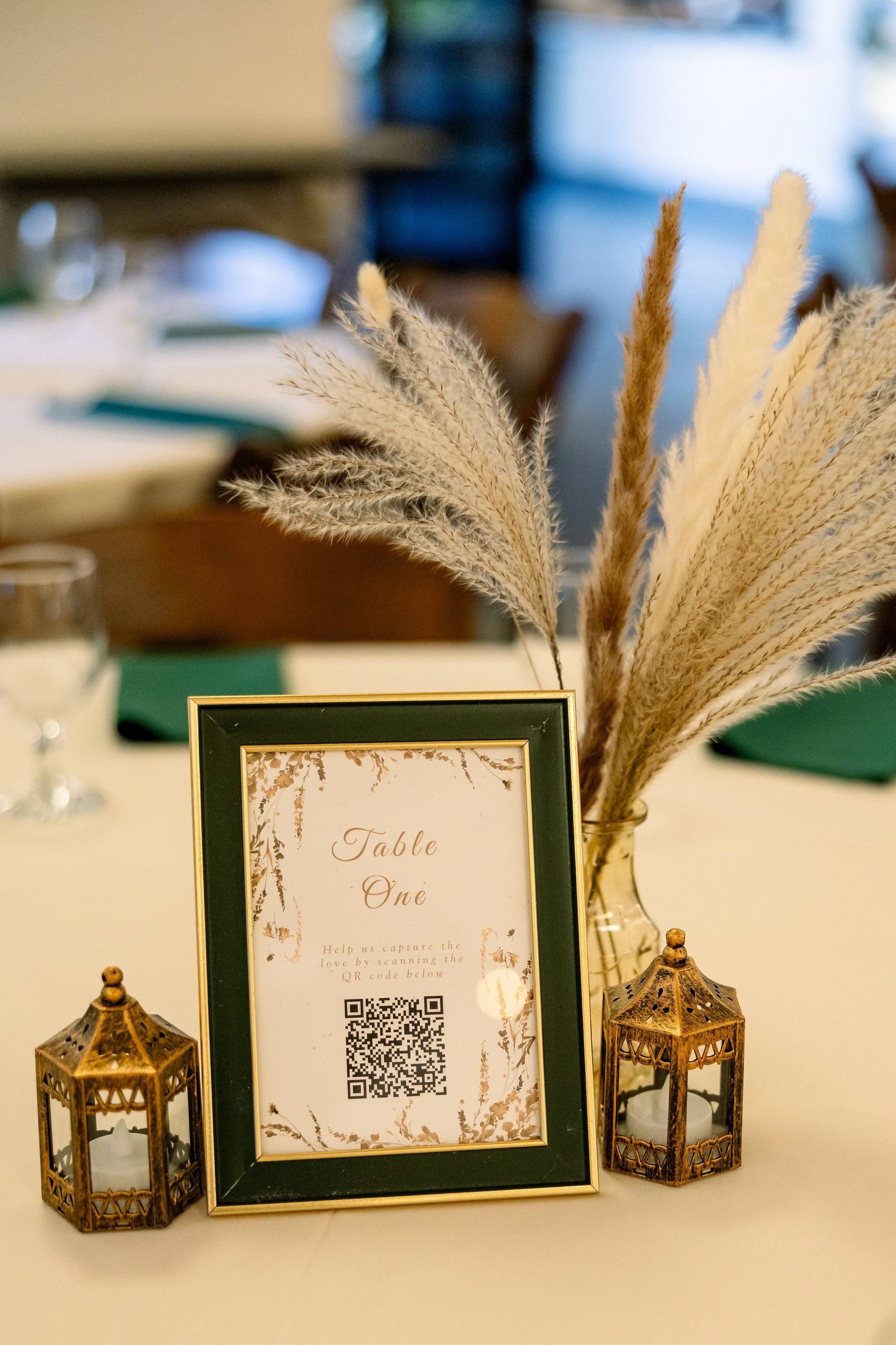 Reception space glowing in warm fall wedding colors