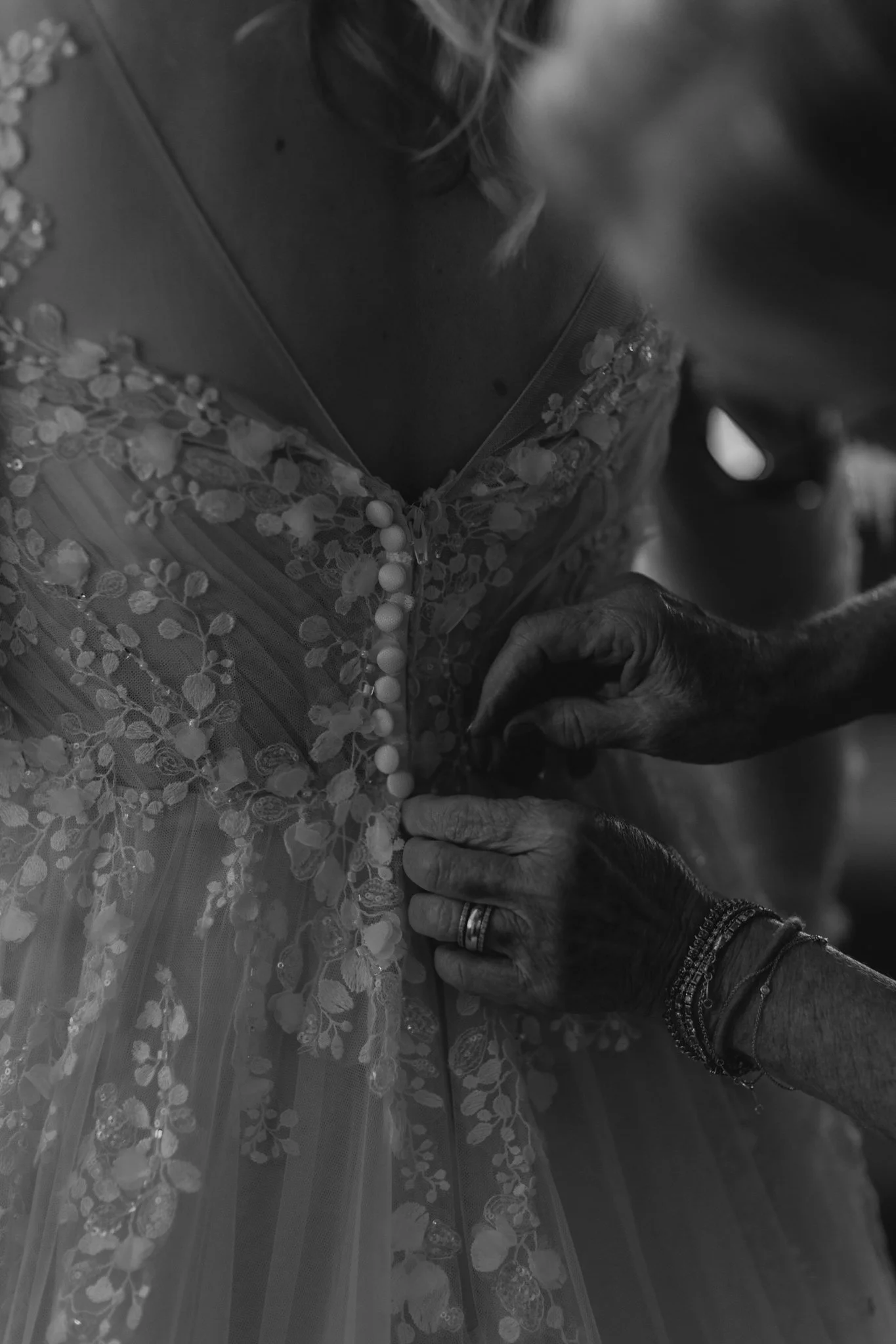 Bride in a beaded lace gown getting ready for her Gilbert, Arizona wedding day