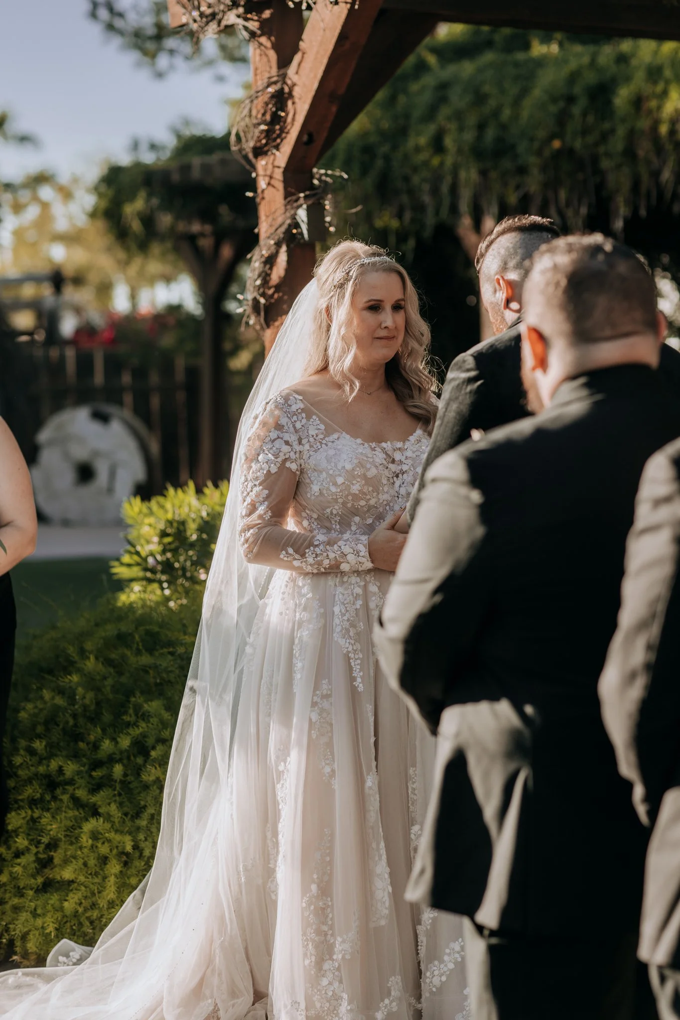 Wide view of a pumpkin-lined ceremony designed by a full service wedding planner