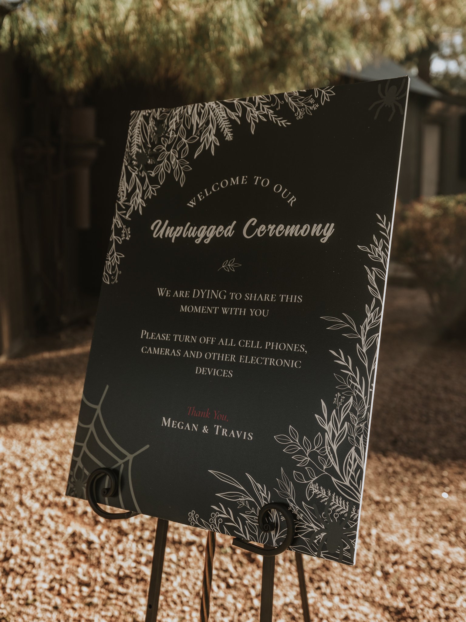 Dying to share this moment unplugged ceremony sign at a dark and moody Halloween wedding