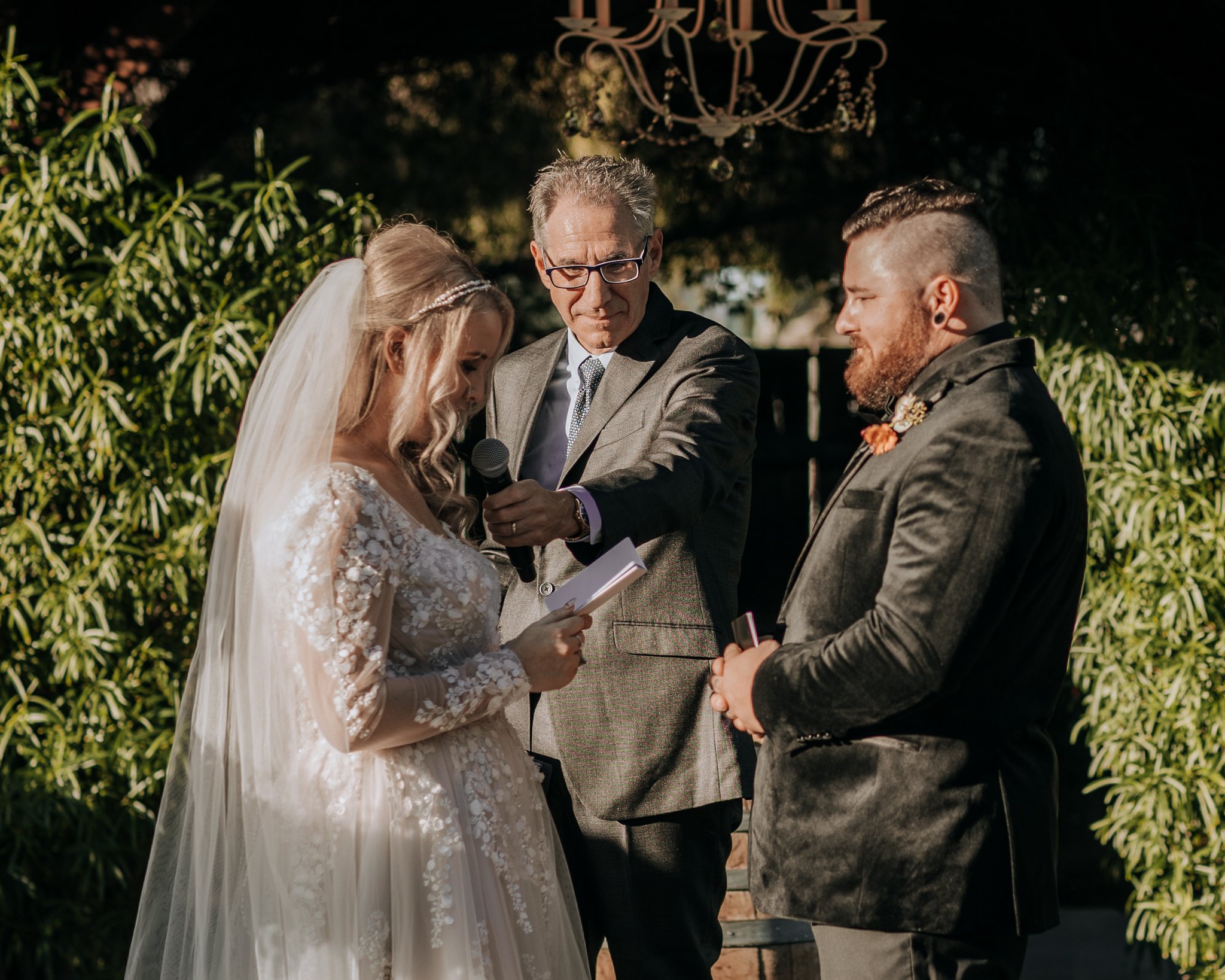 Bride reads her vows during a fall ceremony in Gilbert, Arizona