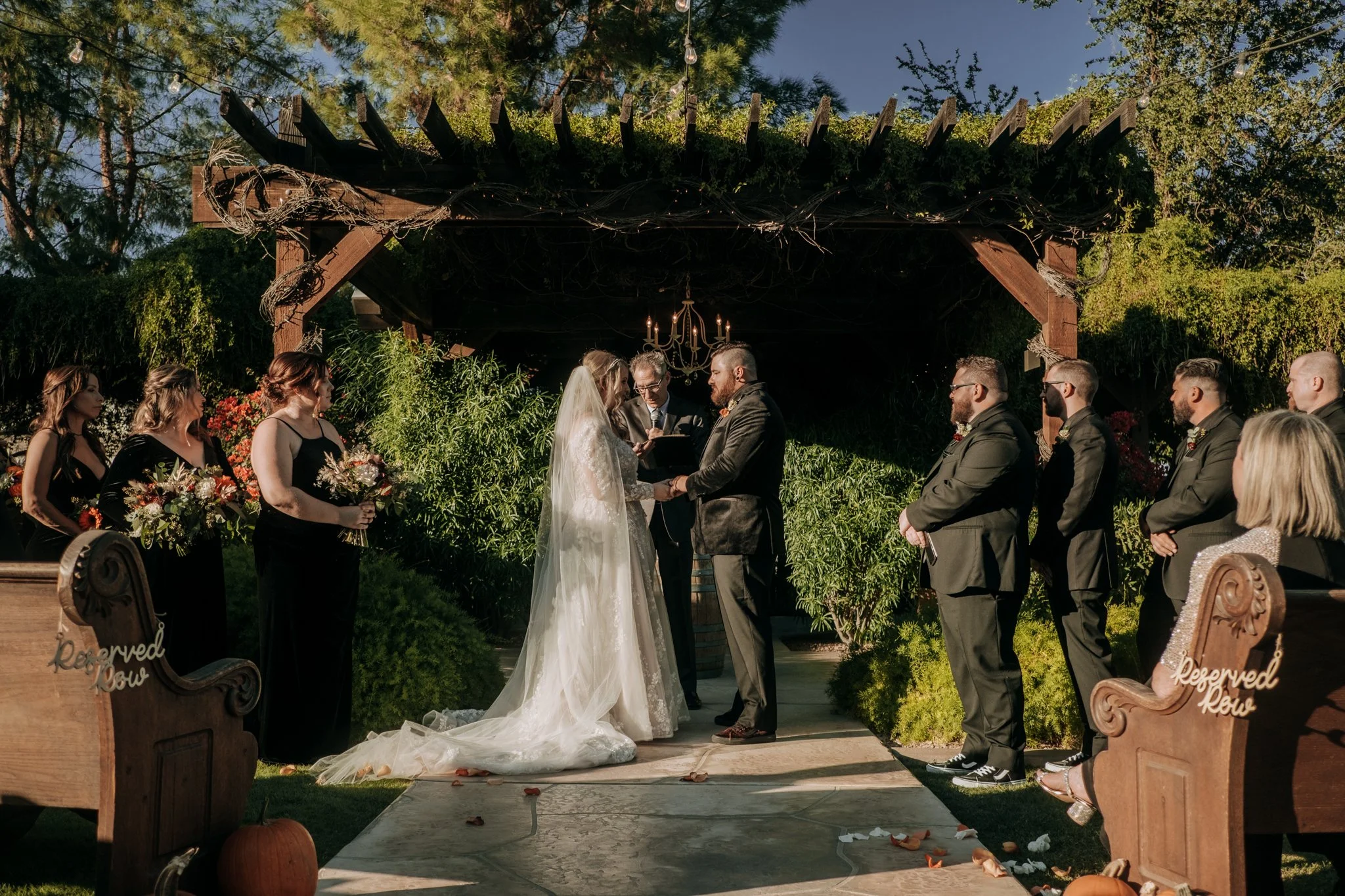 Fall ceremony details with pumpkins tucked along the aisle