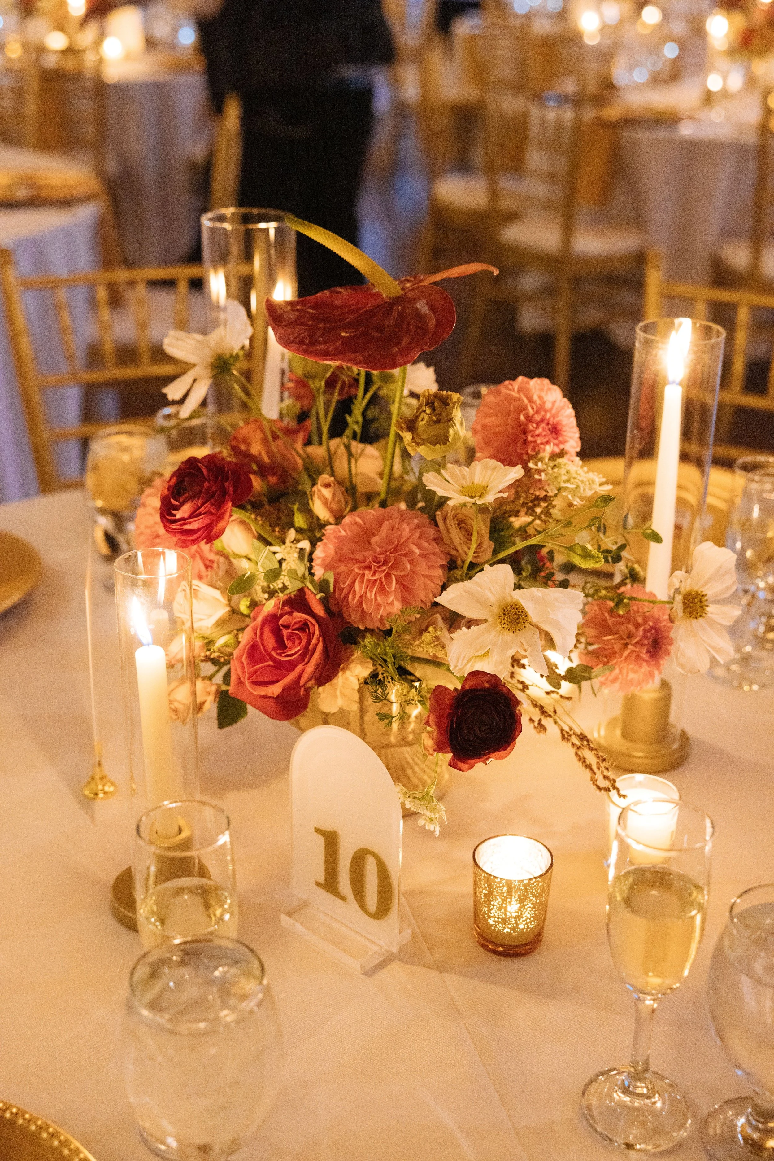 Candlelit centerpiece with dahlias and roses at a Dana Point Yacht Club reception