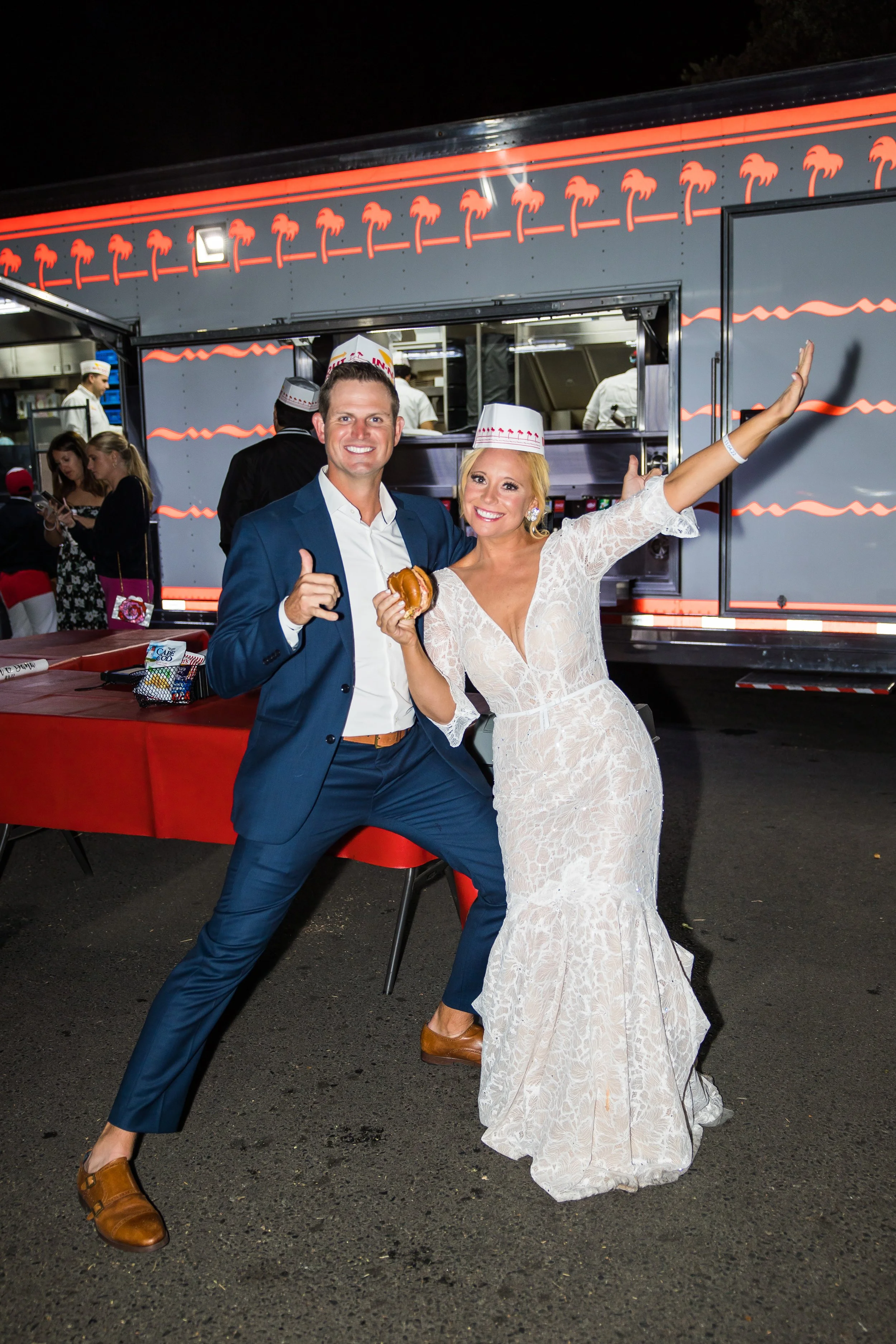 Couple poses at a late-night In-N-Out truck at a Dana Point Yacht Club reception