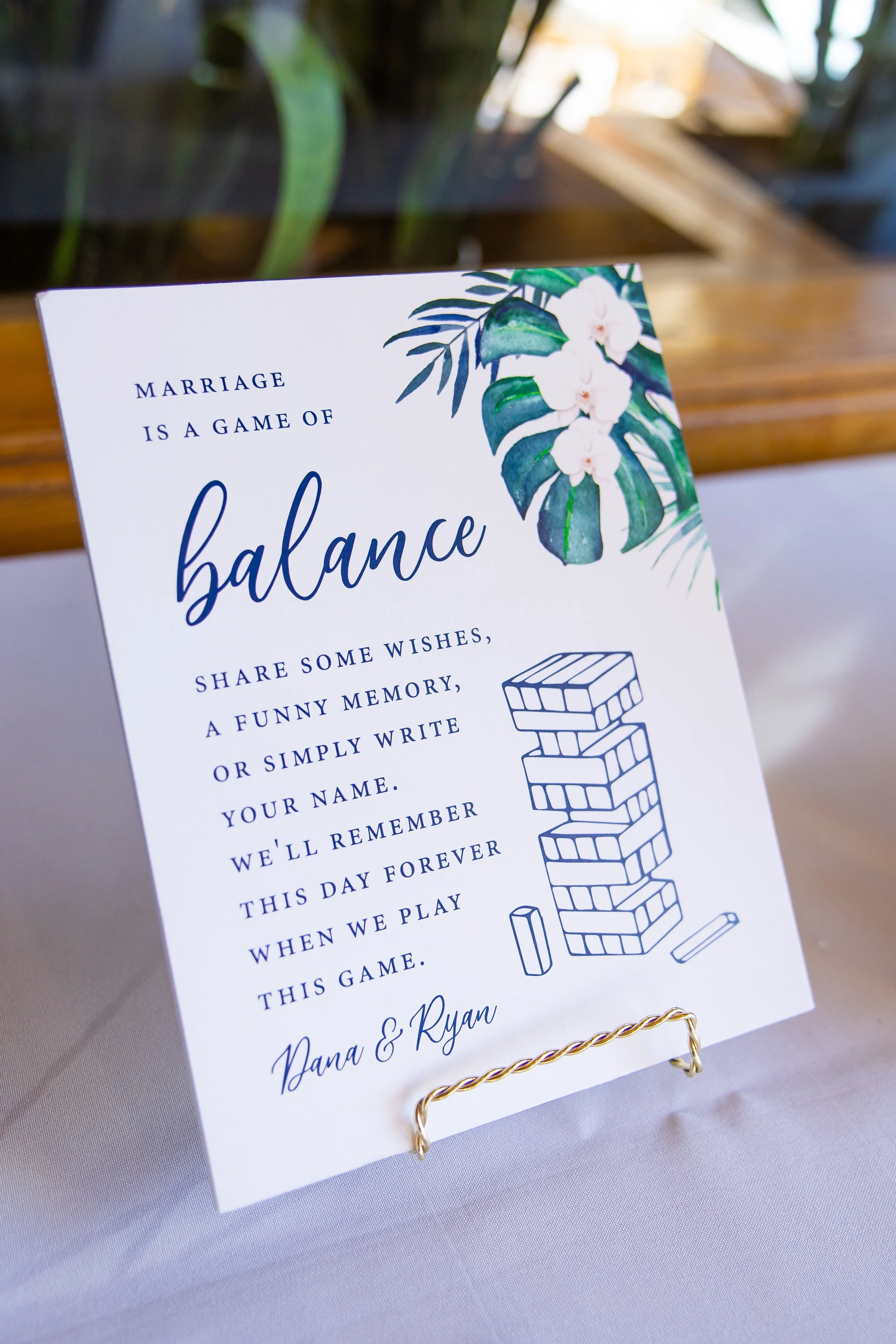 Tropical Jenga guest-book sign at a Dana Point Yacht Club wedding reception