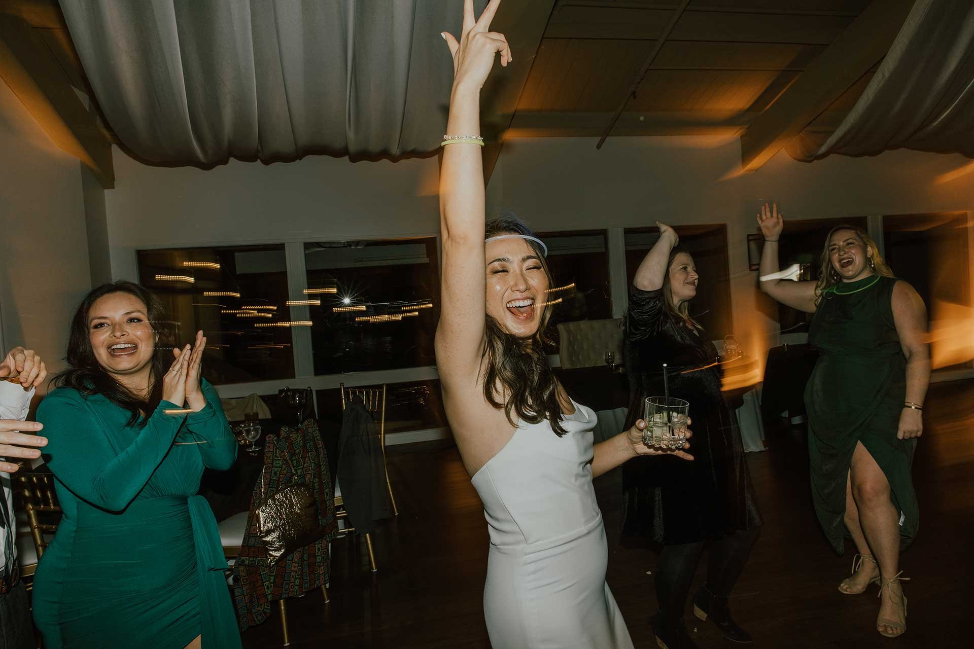 bride having a wonderful time at her wedding reception