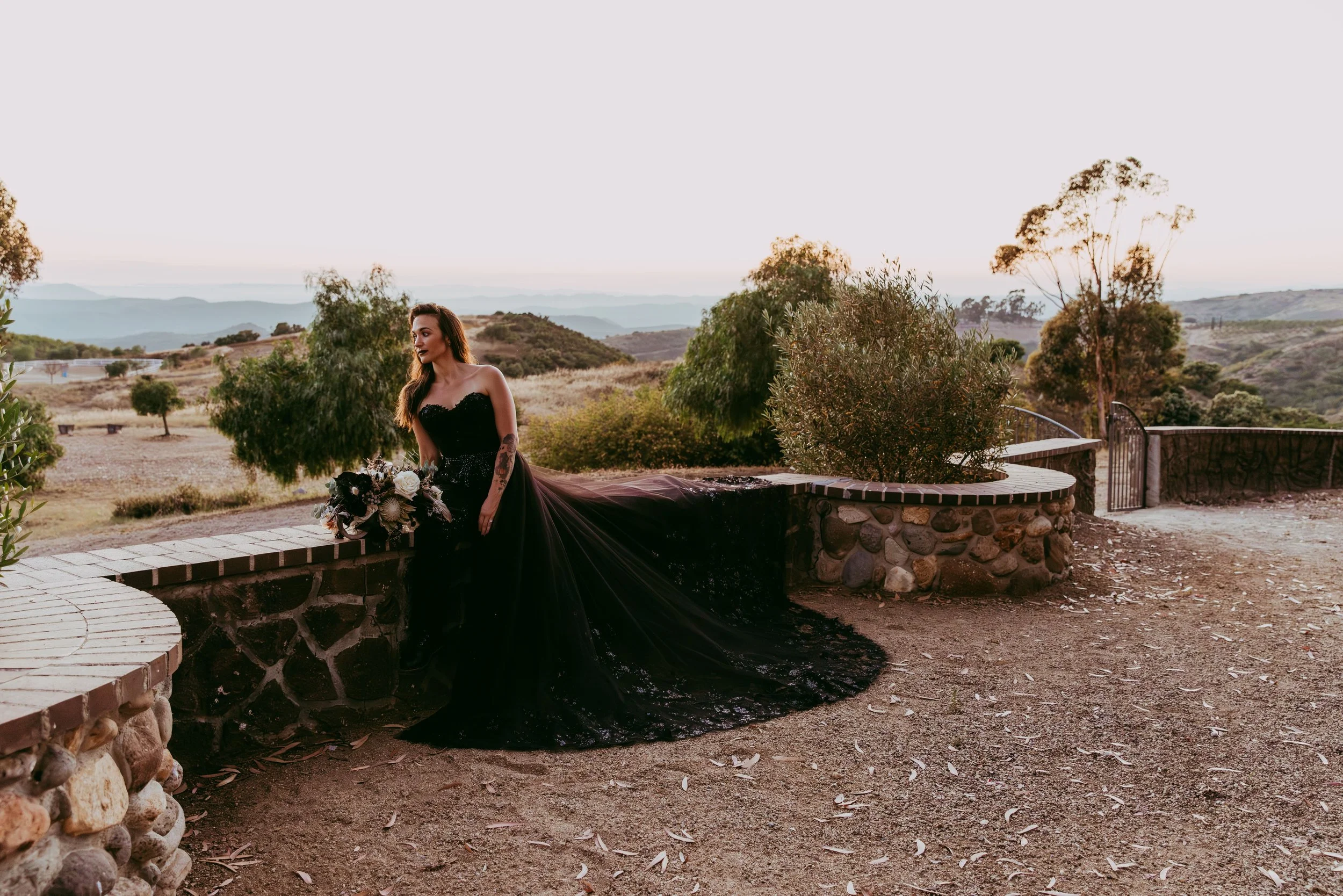 Disney villain wedding inspiration shoot against a brown, dry mountain backdrop