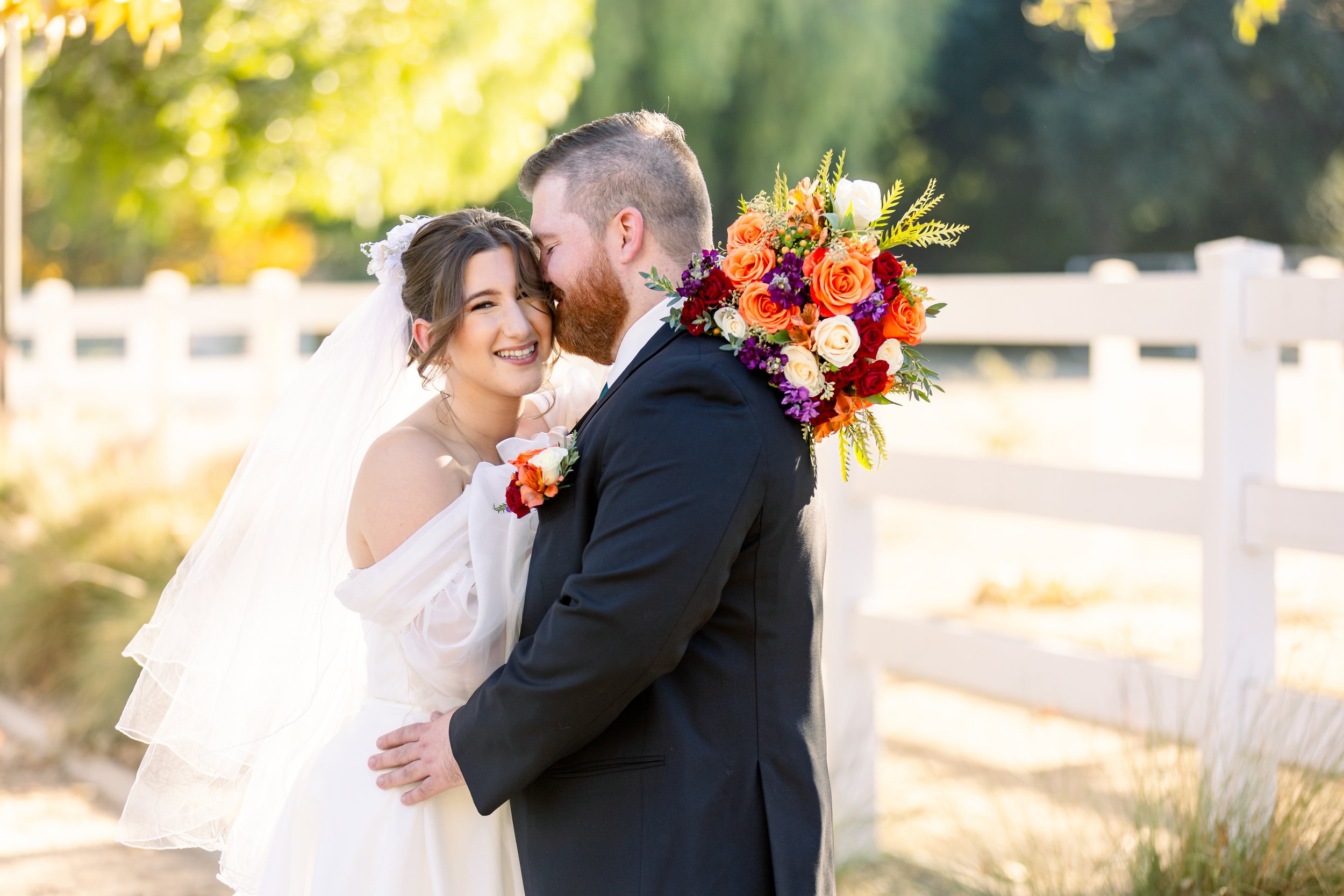 Candid of the couple laughing at their fall wedding