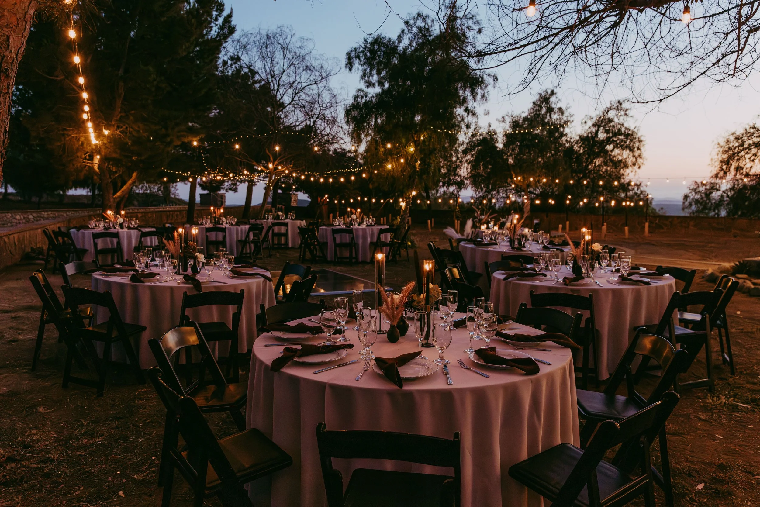 Round reception table styled for an alternative Disney villain wedding in Utah