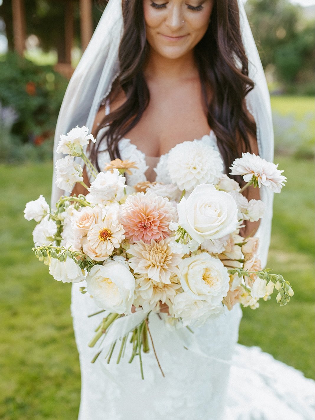 We love when bouquets feel gathered instead of structured &mdash; layers of garden blooms, soft color, and natural movement in every stem.

Peachy dahlias, creamy roses, and delicate textures coming together in a way that feels effortless and full of