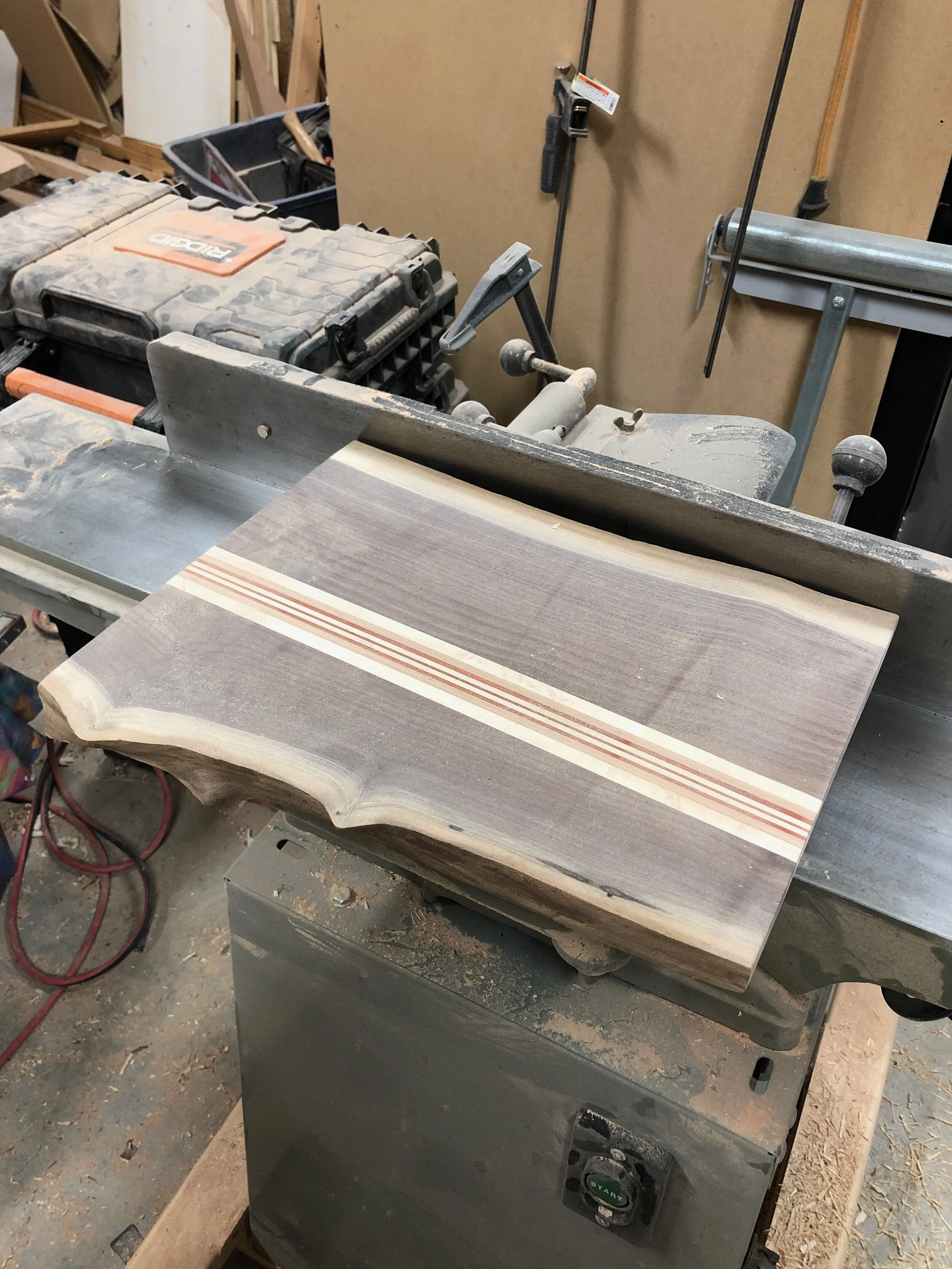 The rough view of the walnut live edge cutting board. 