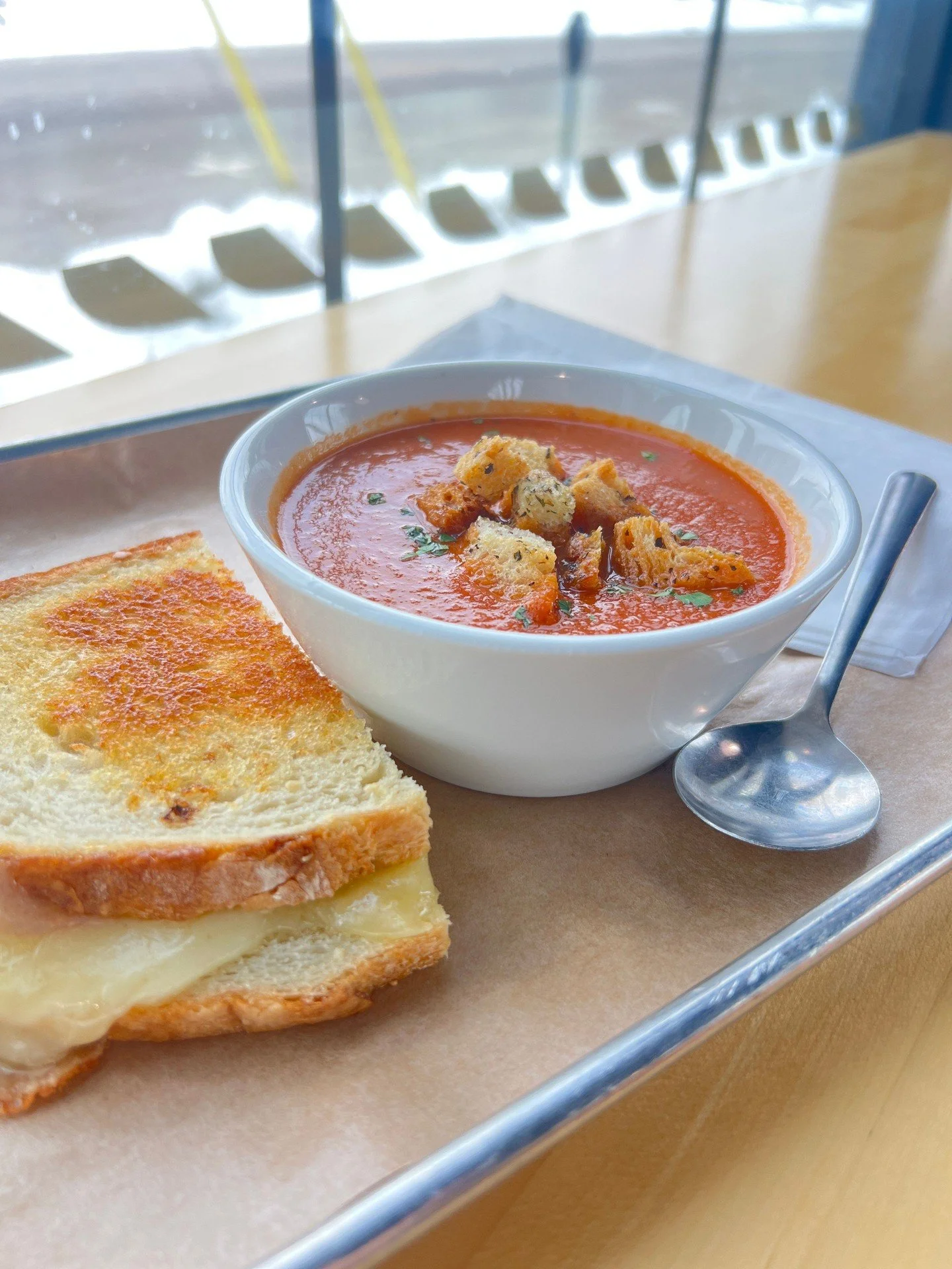 Cold winter days call for warm comfort food.

This week's soup is a classic tomato topped with house-made croutons. Pair it with a half grilled cheese sandwich for $13.95, or add a cup to any sandwich or salad for just $4 more.
Cup $5.95 | Bowl $7.95