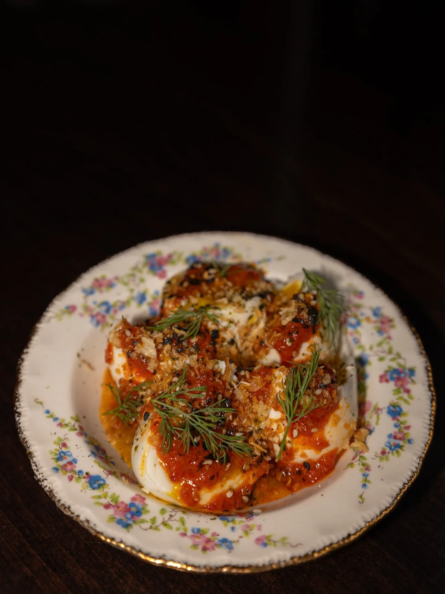 Jammy Eggs
Been with us since the beginning. 
Six minute jammy eggs go down first, with ajvar layered over top, smoky, a little sweet, and gently spiced.
Finished with a good seasoning of furikake, fresh dill, and crispy garlic.
Simple, thoughtful, a
