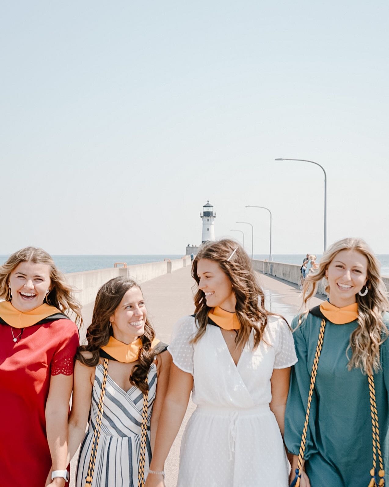 📍 Duluth, MN is filled with so many awesome backdrops - whether it be lighthouses, the famous lift bridge, or the nature just steps outside of the city. 

Congratulations to these 4 on their graduation from St. Scholastica! 👨&zwj;🎓 

DM me to set 