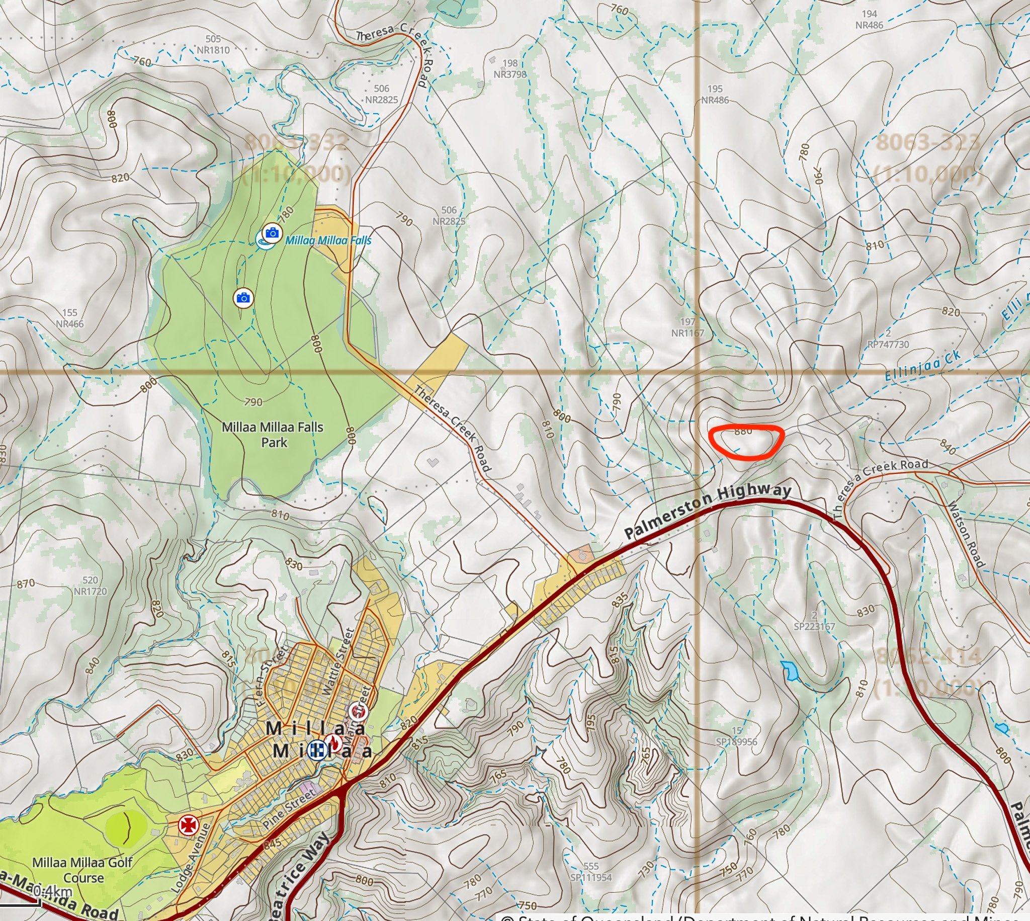 Bradleys Hill (880 m, circled) rises just east of the falls. Its drainage fans out across the country — Theresa Creek to the falls, Ellinjaa Creek to the northeast — which is why its lava is the likely source of the rock in the face.