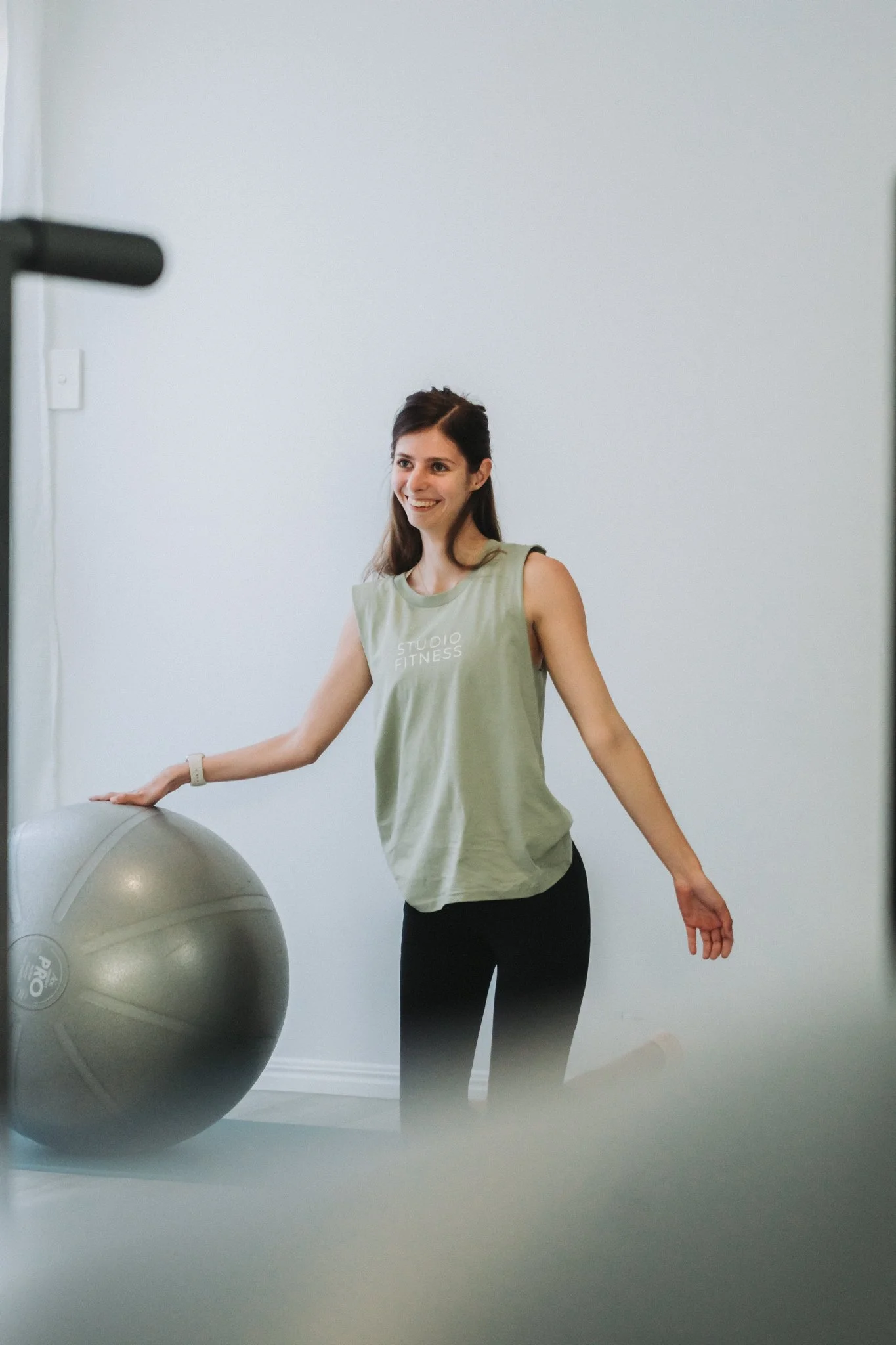 A beautiful, young, NDIS participant working her excersises through and enjoying every moment