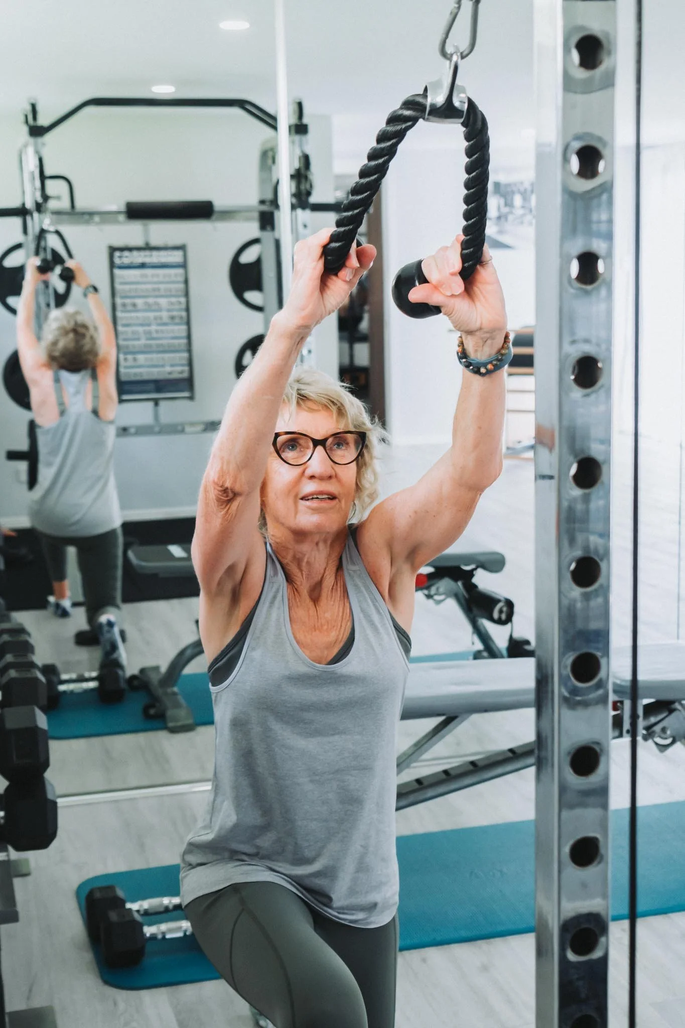 A mature female client enjoying strength based movement