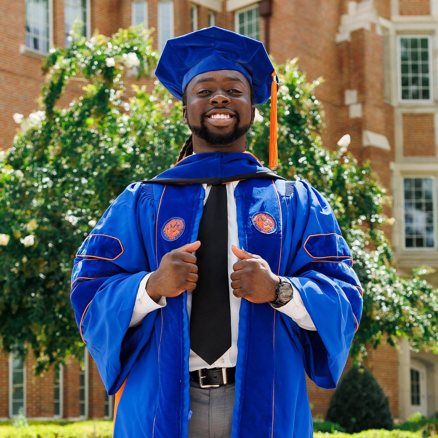 Becky Browndorf posing in graduation regalia