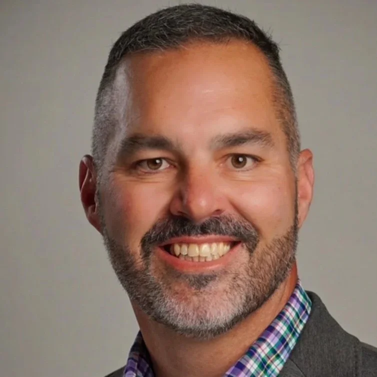 Portrait of Todd Kelly smiling looking into the camera