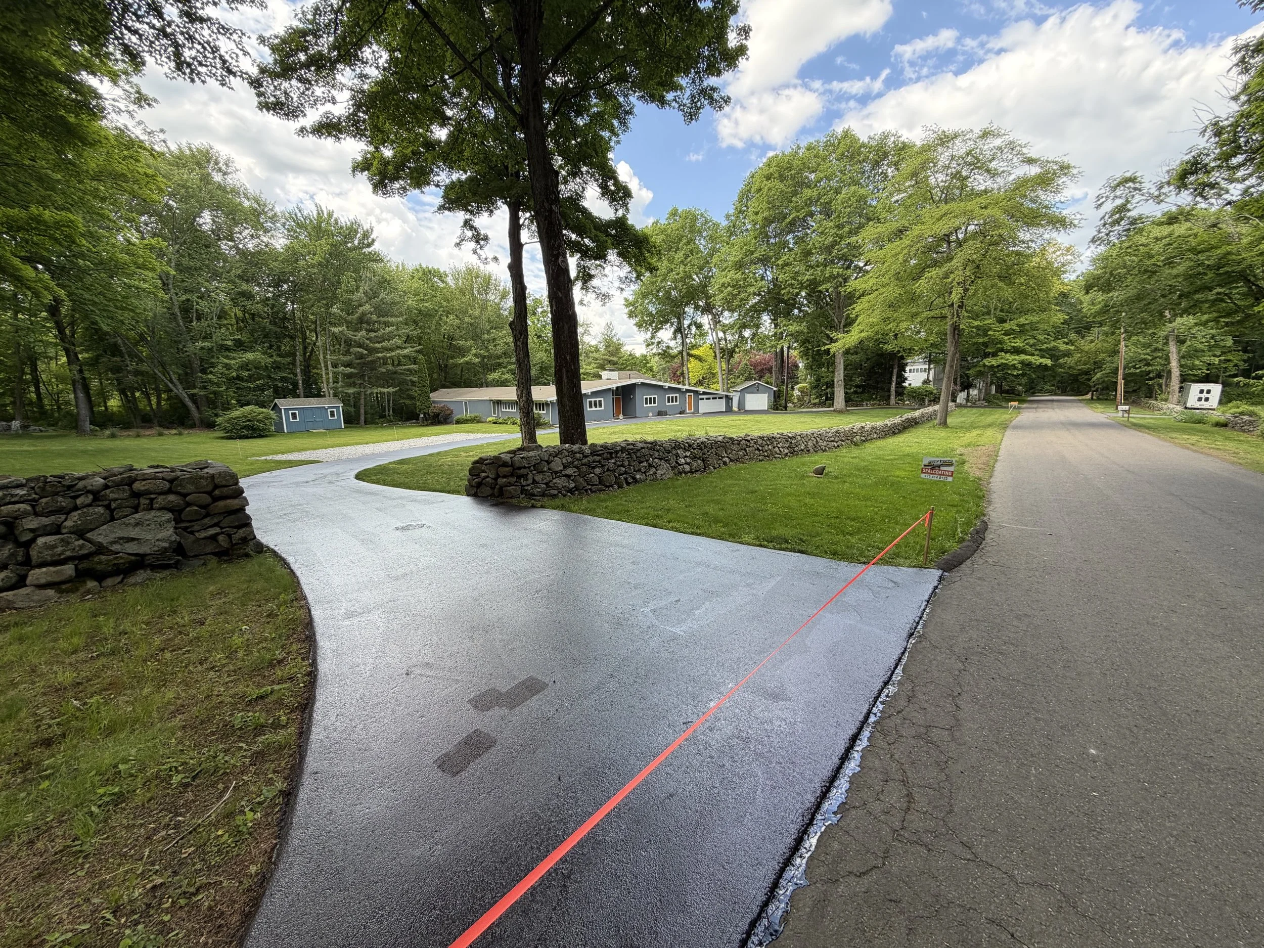 A fresh sealcoat can make a dramatic difference, and this project in Woodbridge in May 2026 is a perfect example.