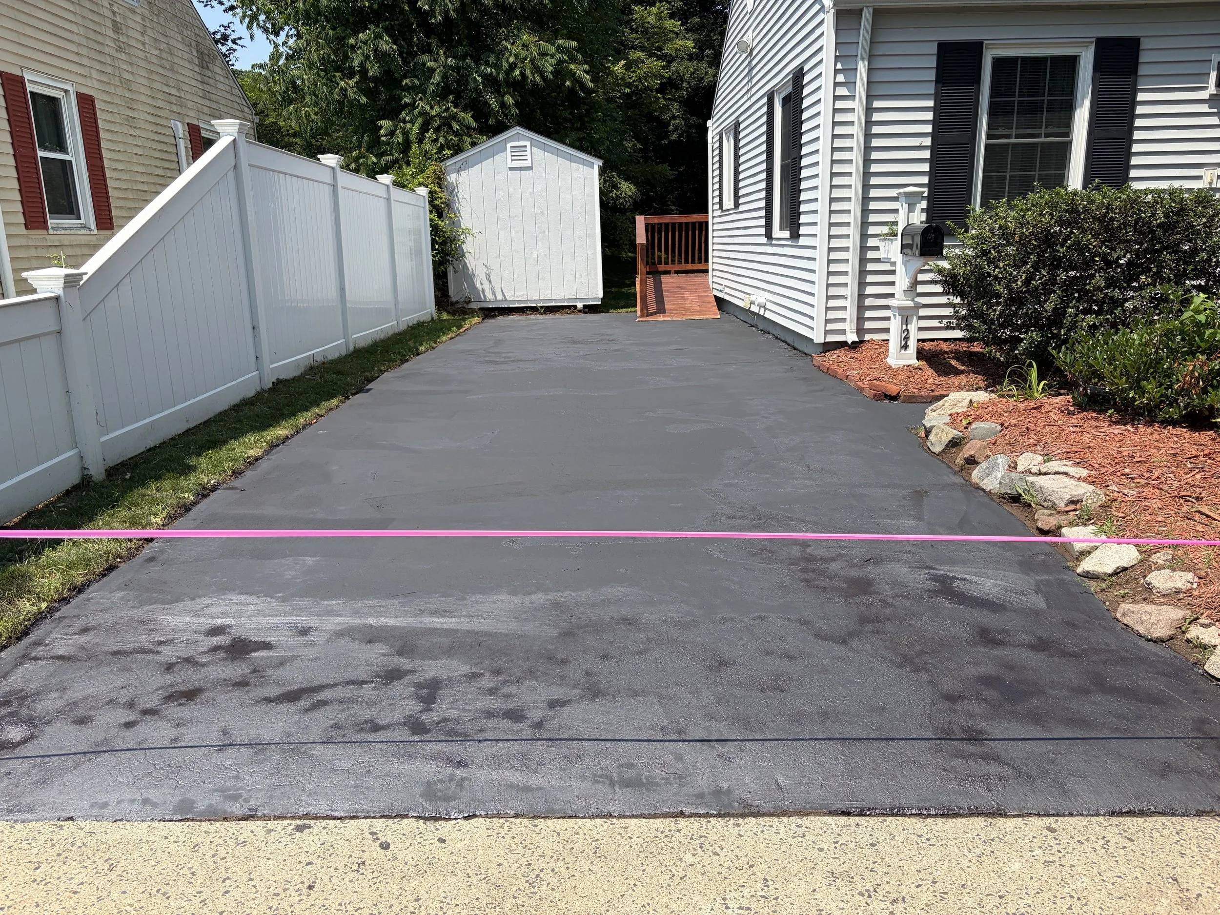Asphalt driveway sealcoating done July 2026 in New Haven, CT.