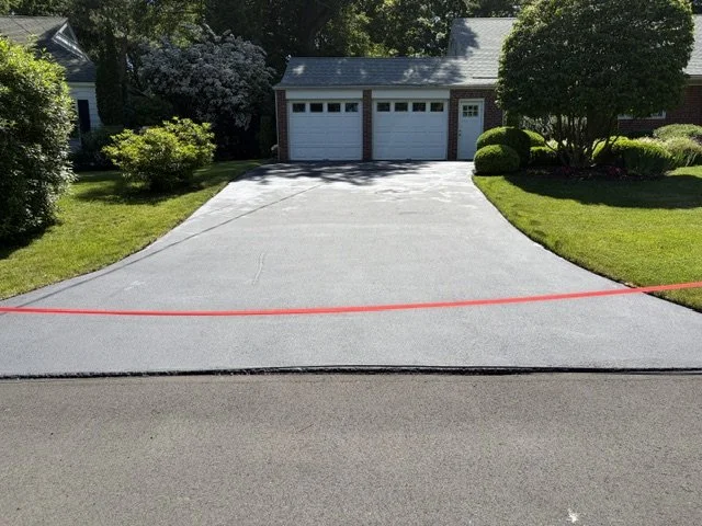Asphalt driveway sealcoating done June 3, 2026, in New Haven, CT.