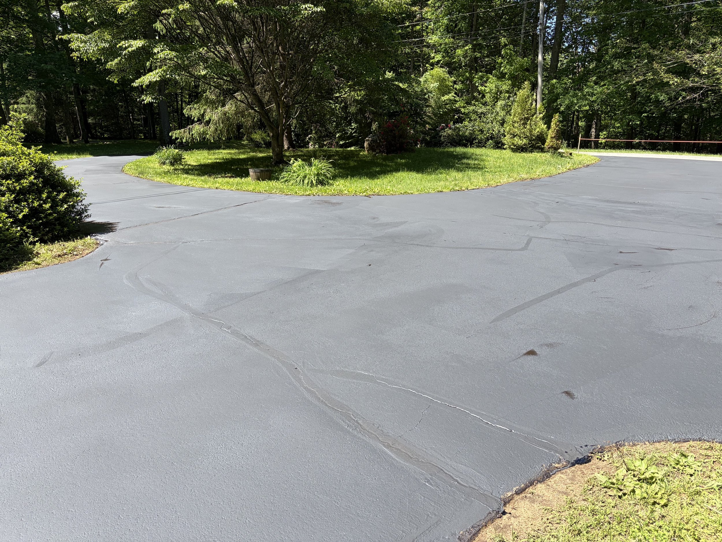 This complete driveway sealcoating project in Guilford gave this large residential property a smooth, protected finish that helps defend against weather, UV damage, oil stains, and everyday wear.