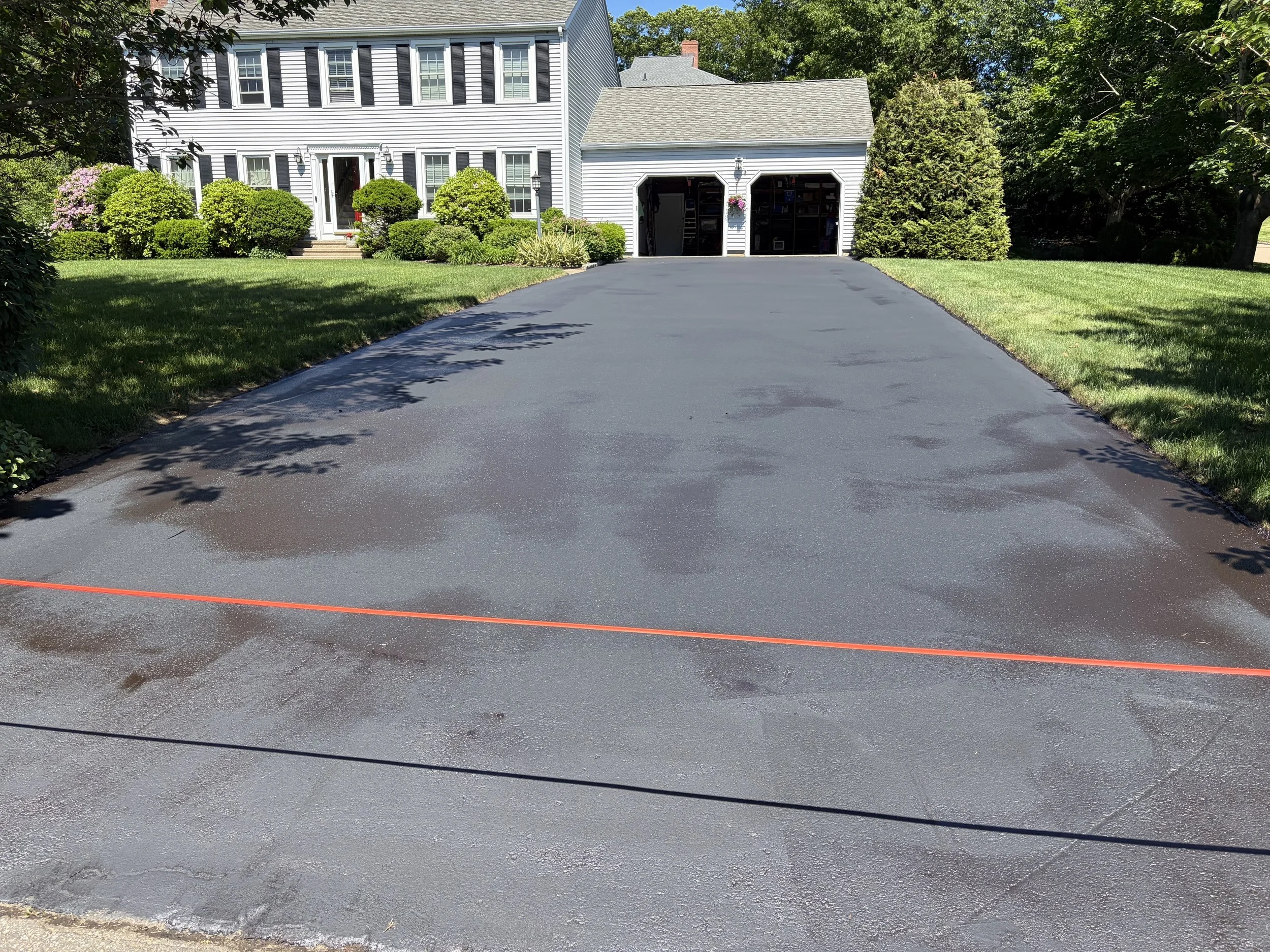 Residential driveway sealcoating project done June 8, 2026 in Branford.