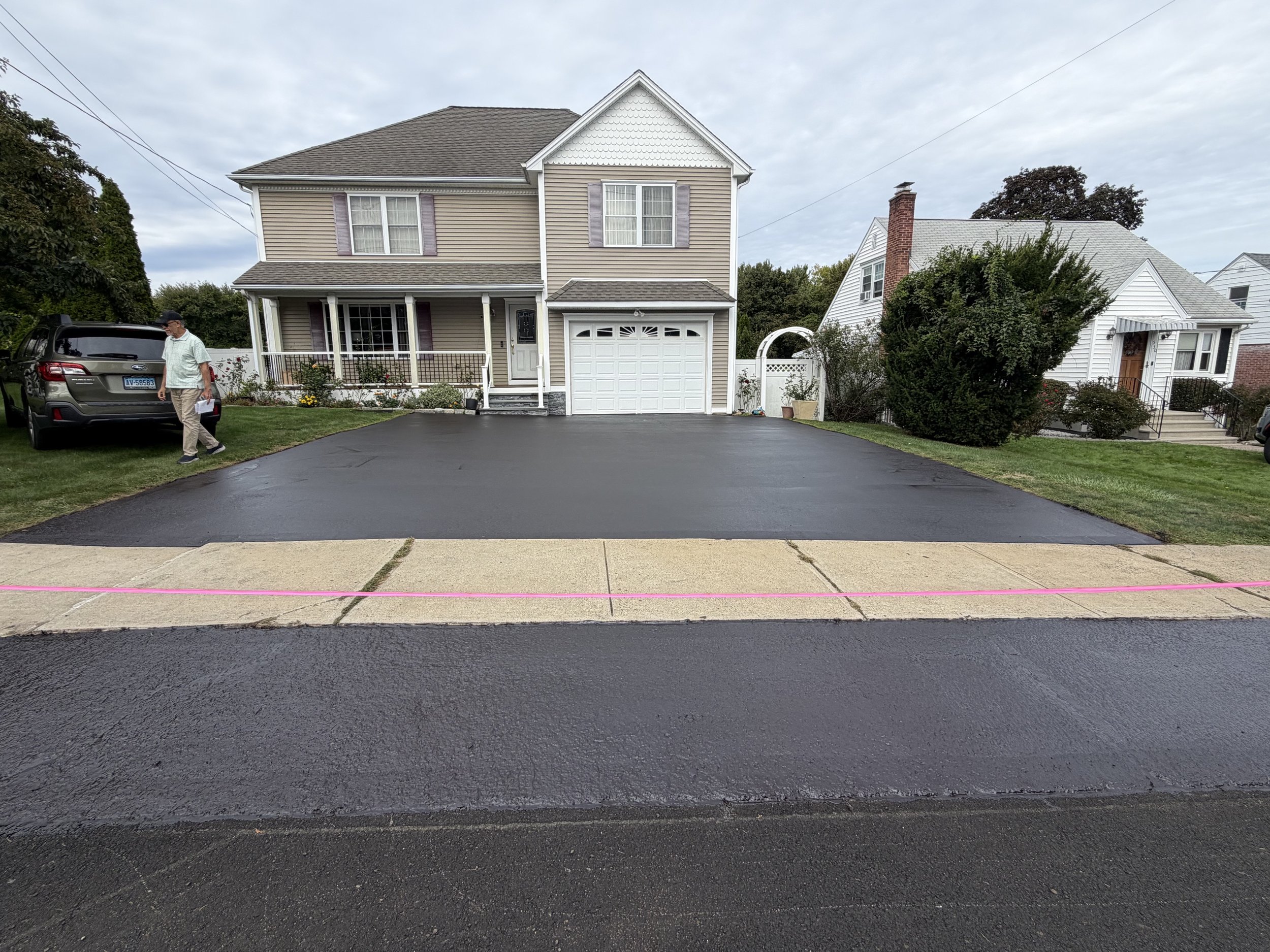 West Haven driveway has new layer of sealcoating ready for the winter of 2026-27.