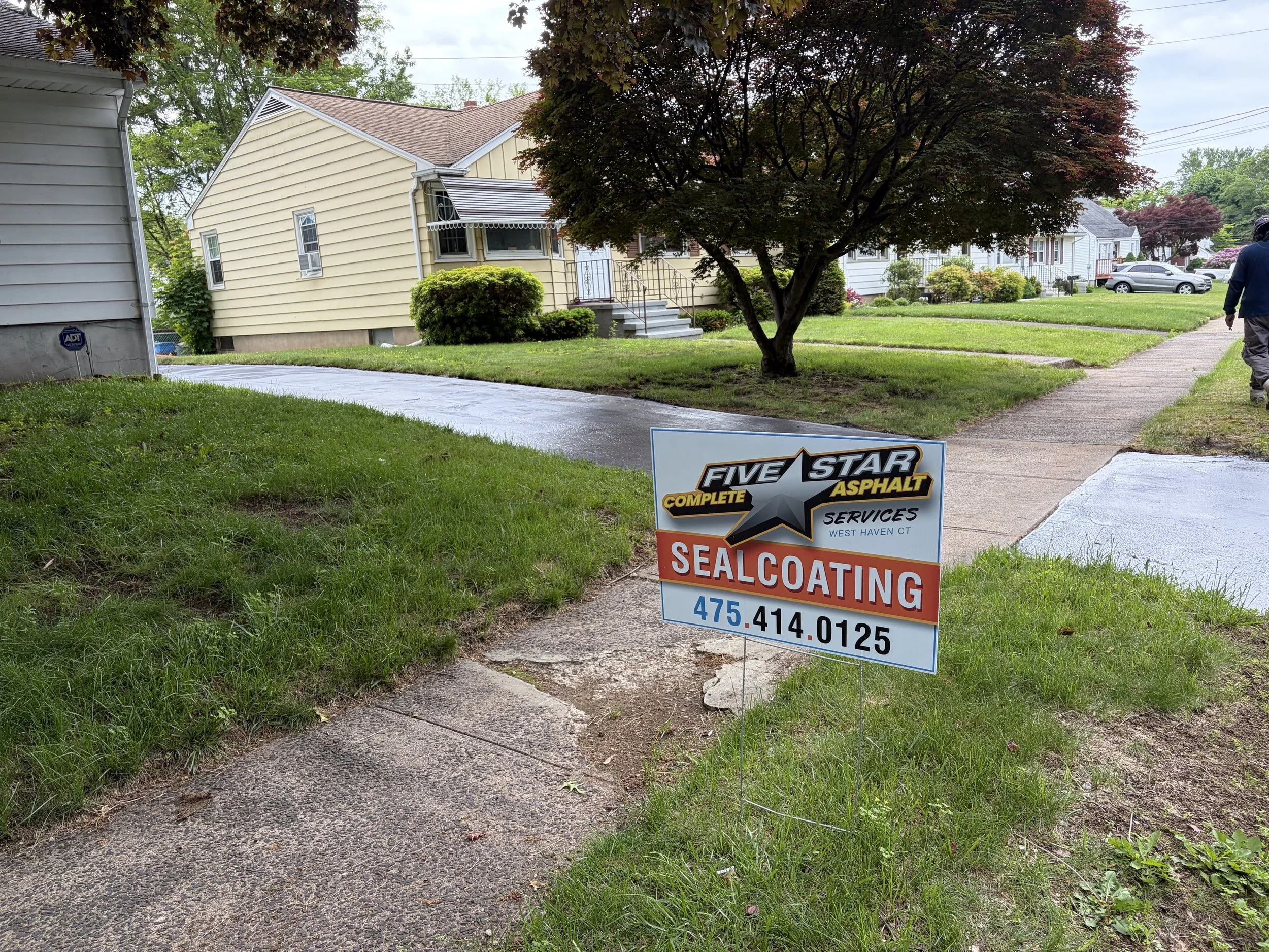 Fresh driveway transformation with asphalt sealcoating completed in Hamden in May 2026.