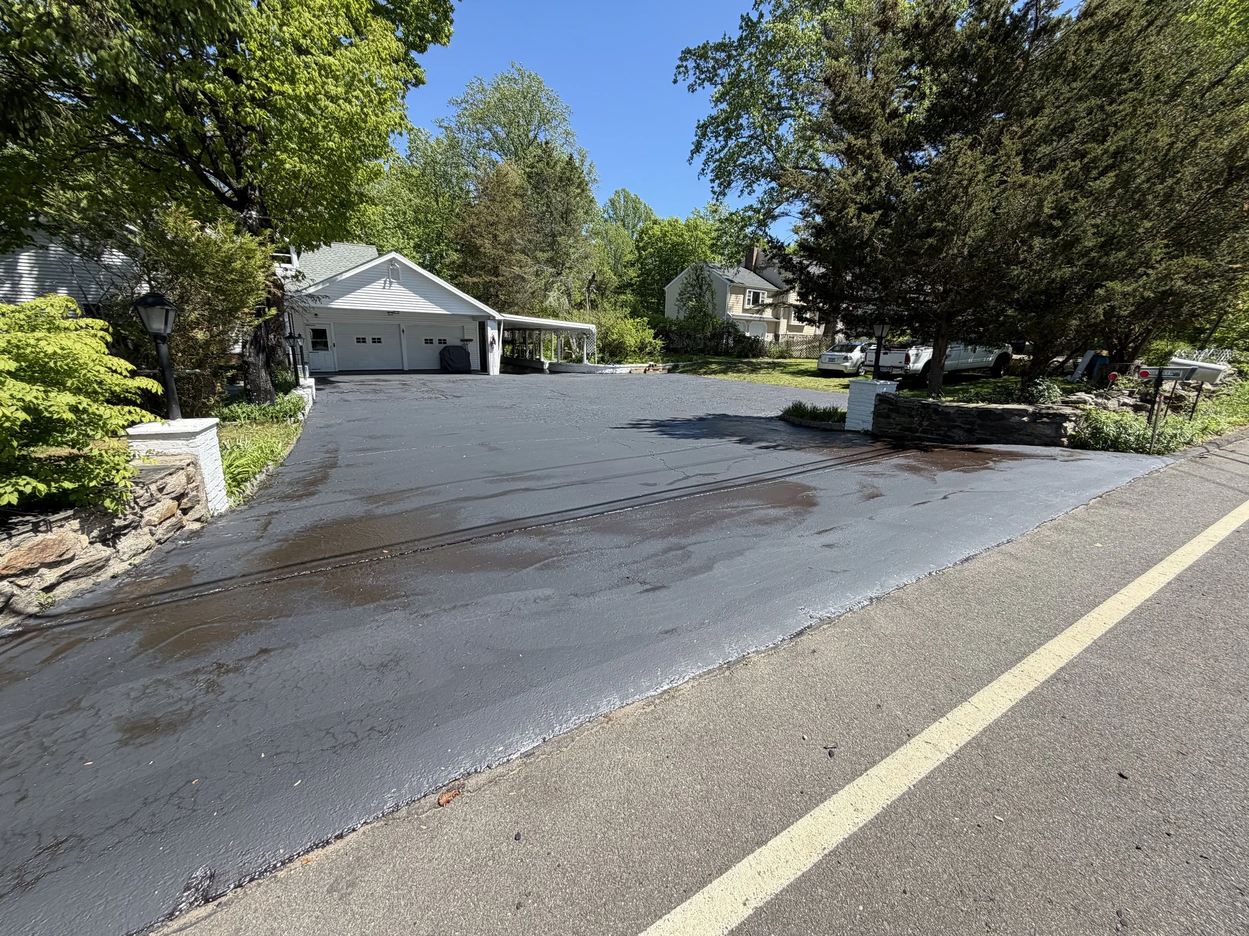 Residential driveway sealcoating project completed in Trumbull, Connecticut.