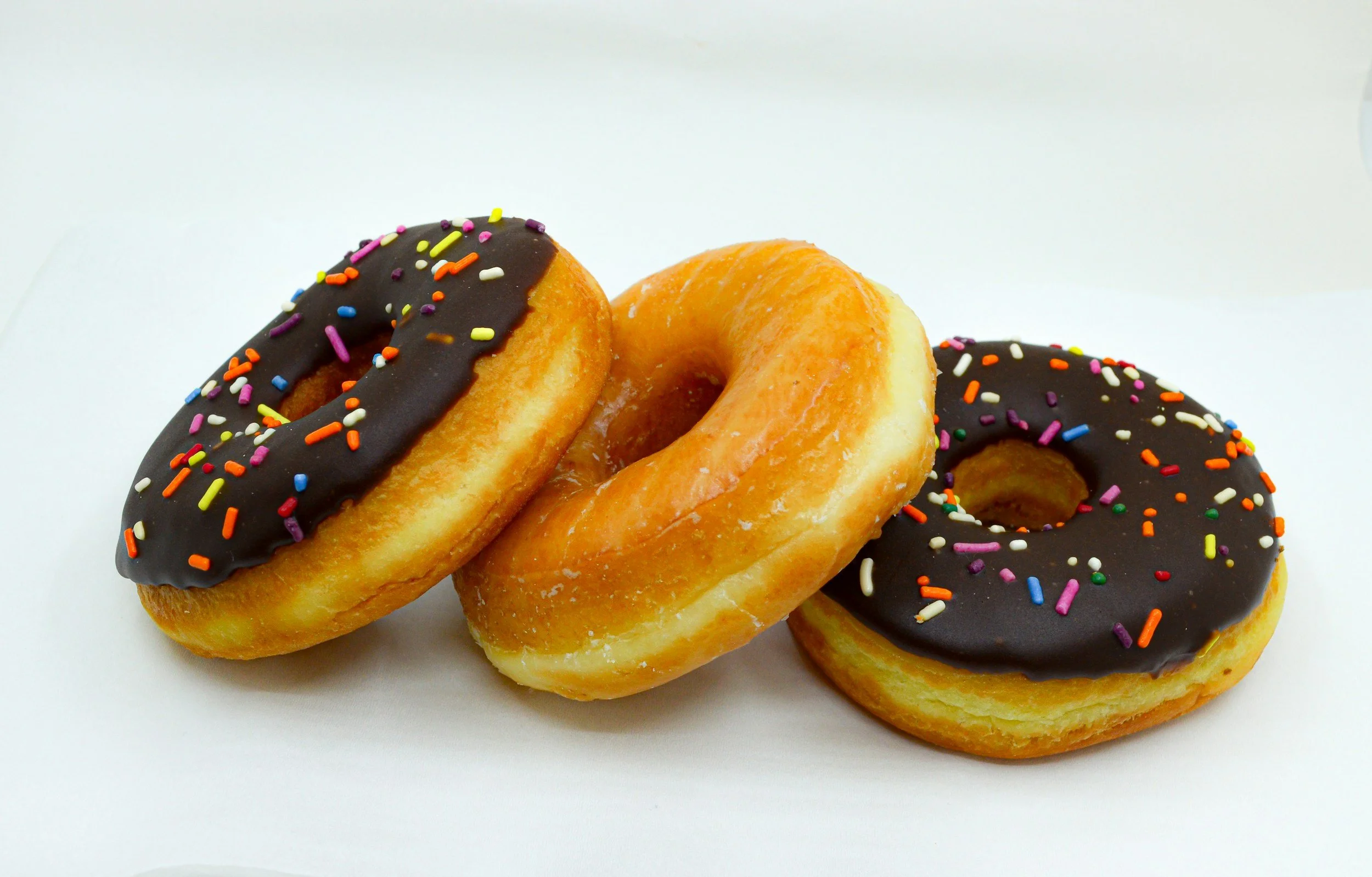 Three stacked doughnut sprinkles and glaxed